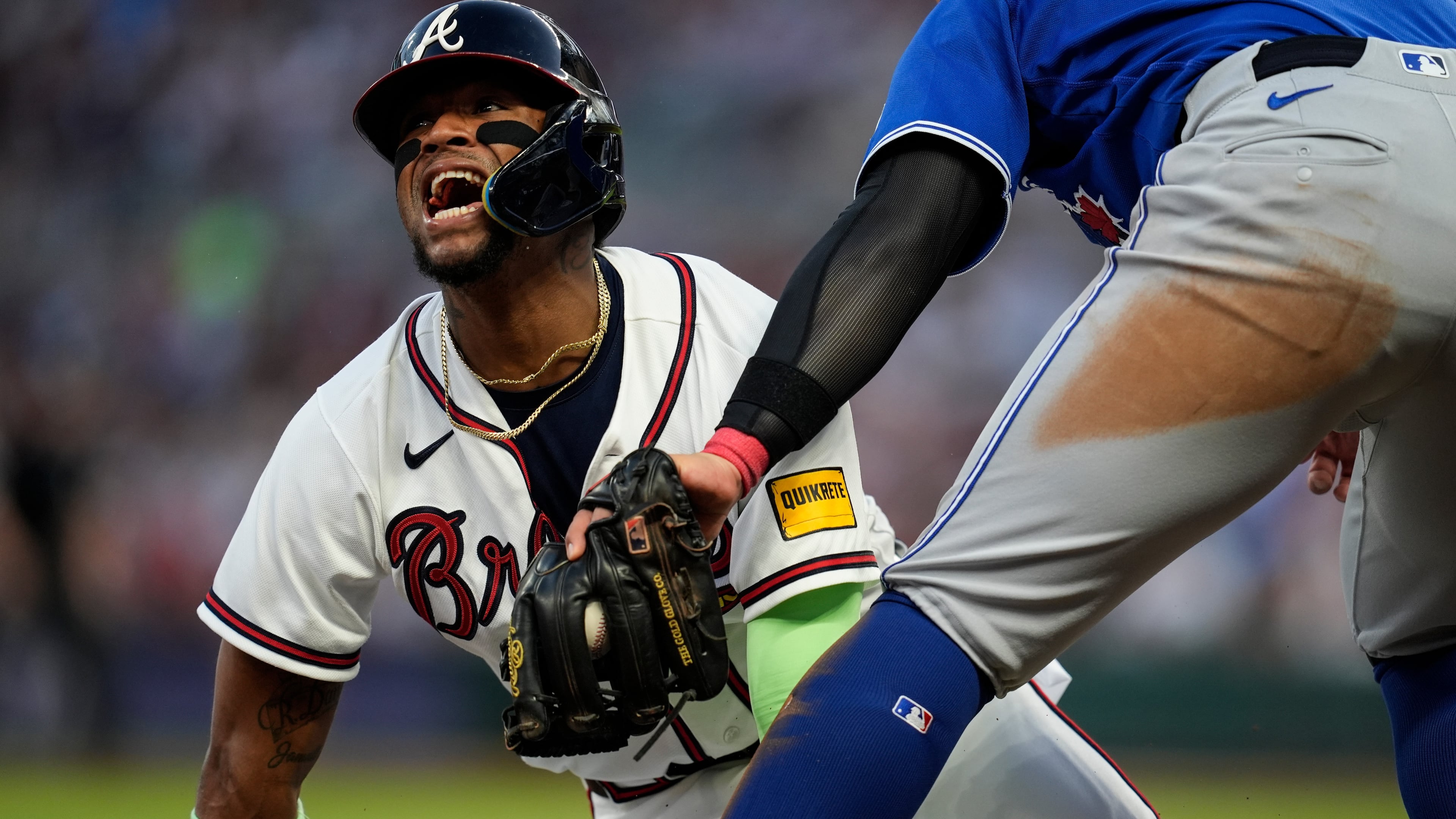 FILE - Atlanta Braves' Ronald Acuña Jr. (13) steals third base against Toronto Blue Jays third baseman Kazuma Okamoto (7) in the fifth inning of a baseball game on June 3, 2026, in Atlanta. (AP Photo/Mike Stewart, File)