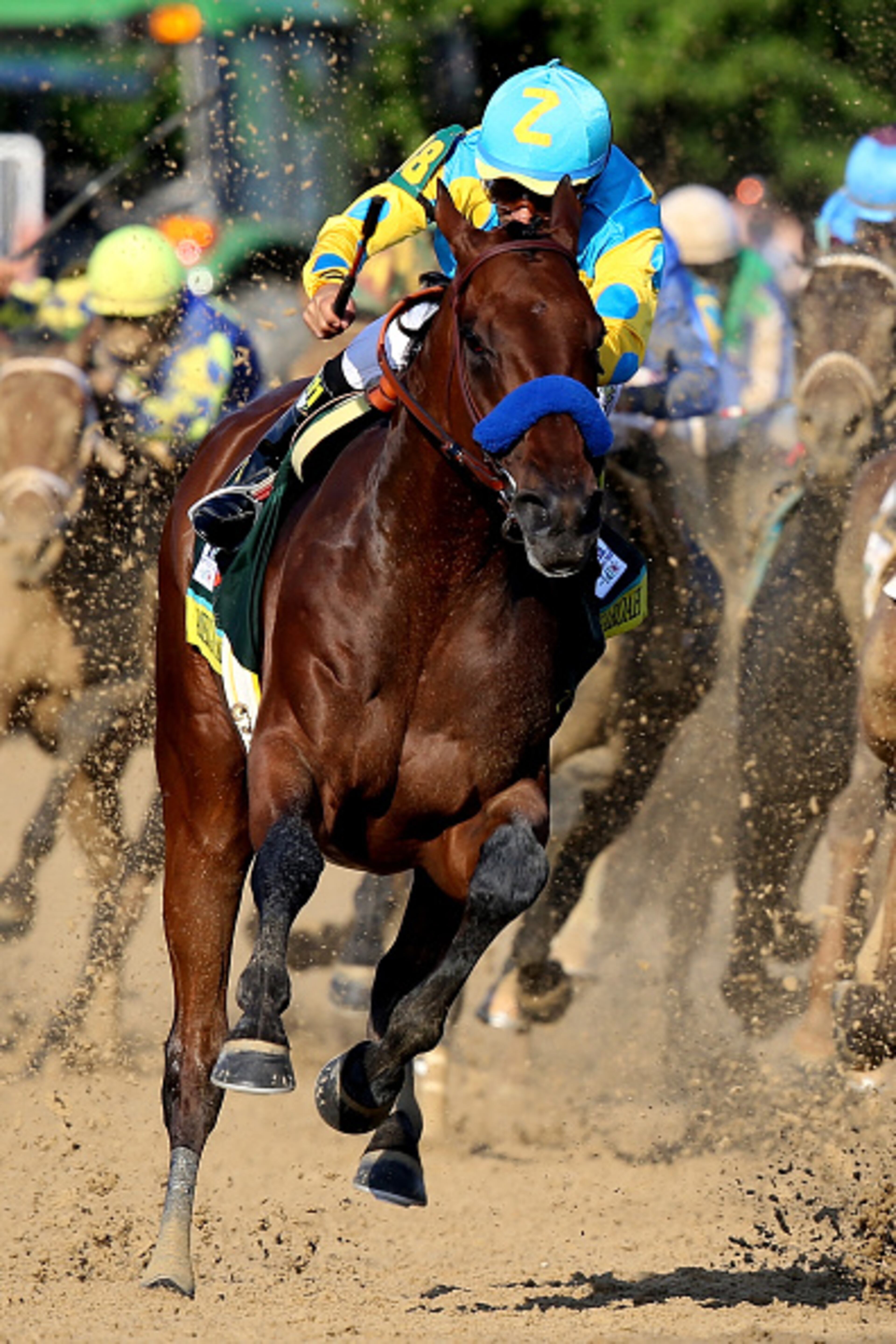 LOUISVILLE, KY - MAY 02: American Pharoah #18, ridden by Victor Espinoza, comes out of turn 4 during the 141st running of the Kentucky Derby at Churchill Downs on May 2, 2015 in Louisville, Kentucky. (Photo by Andy Lyons/Getty Images)