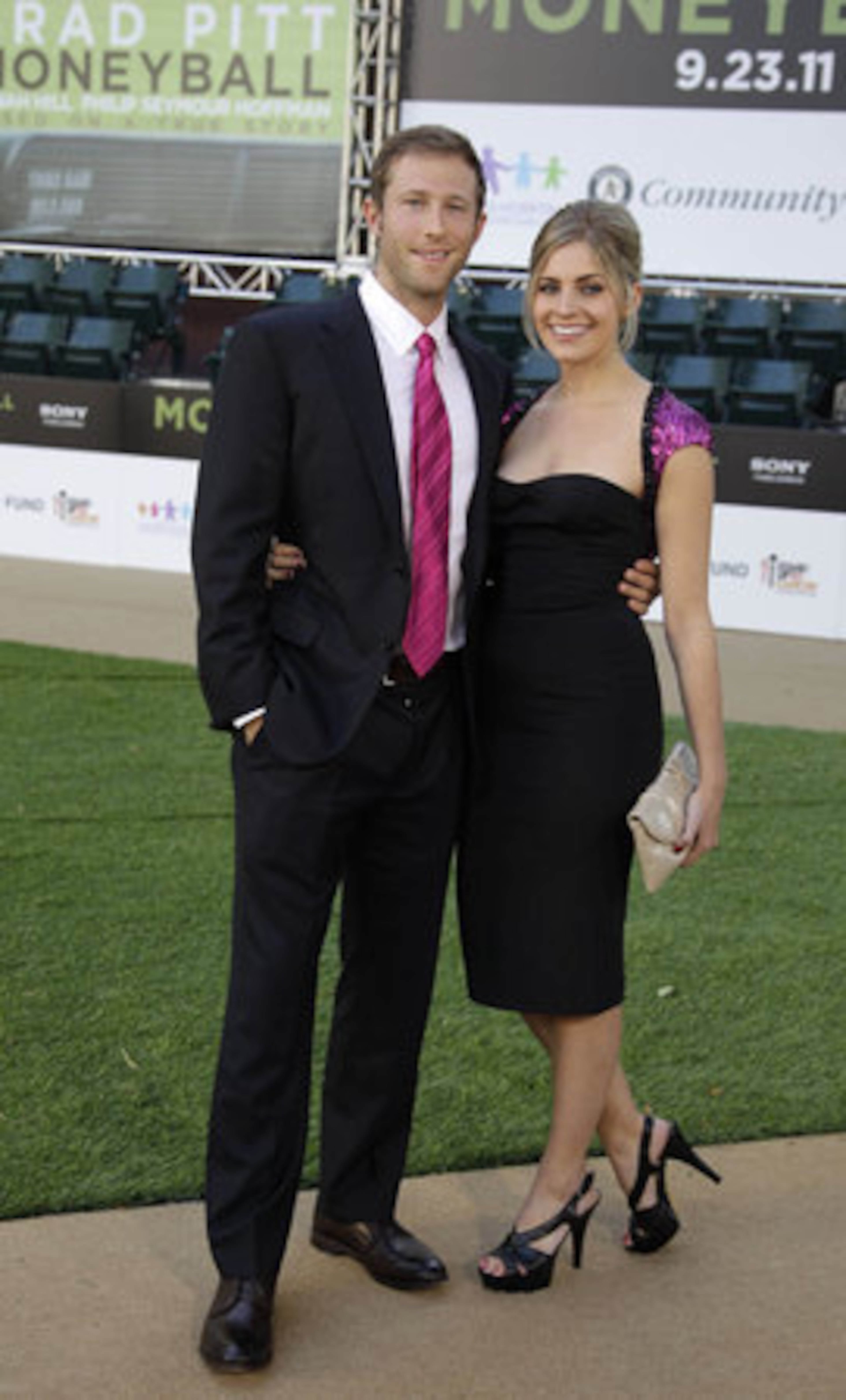 Actor Casey Bond, left, arrives at the premiere screening of "Moneyball." He portrays Oakland Athletics' Chad Bradford in the film.