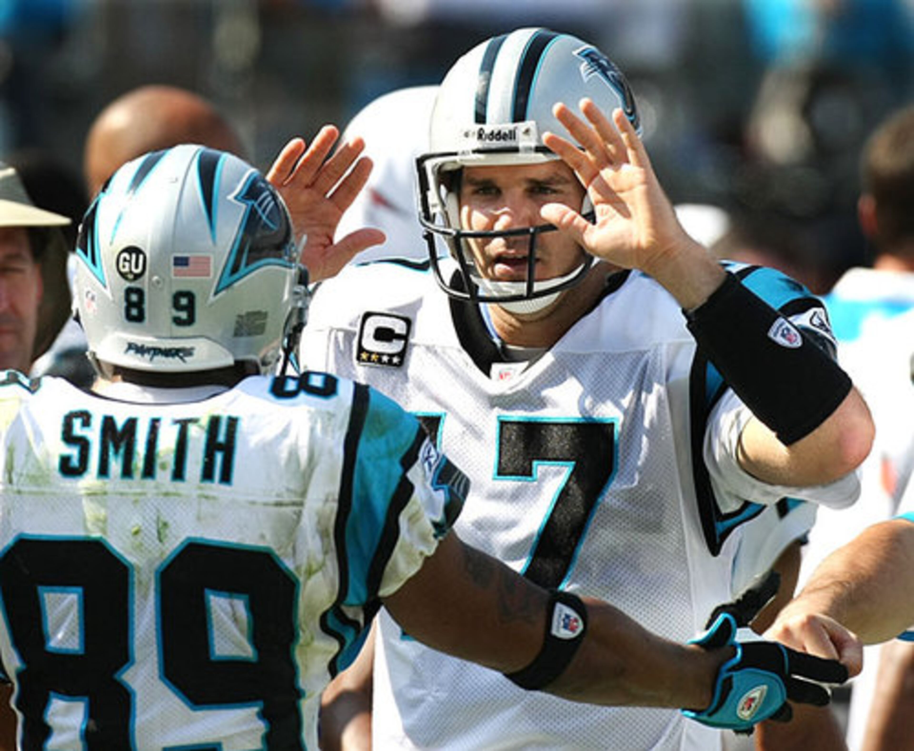 Panthers quarterback Jake Delhomme celebrated with Smith after the long touchdown.
