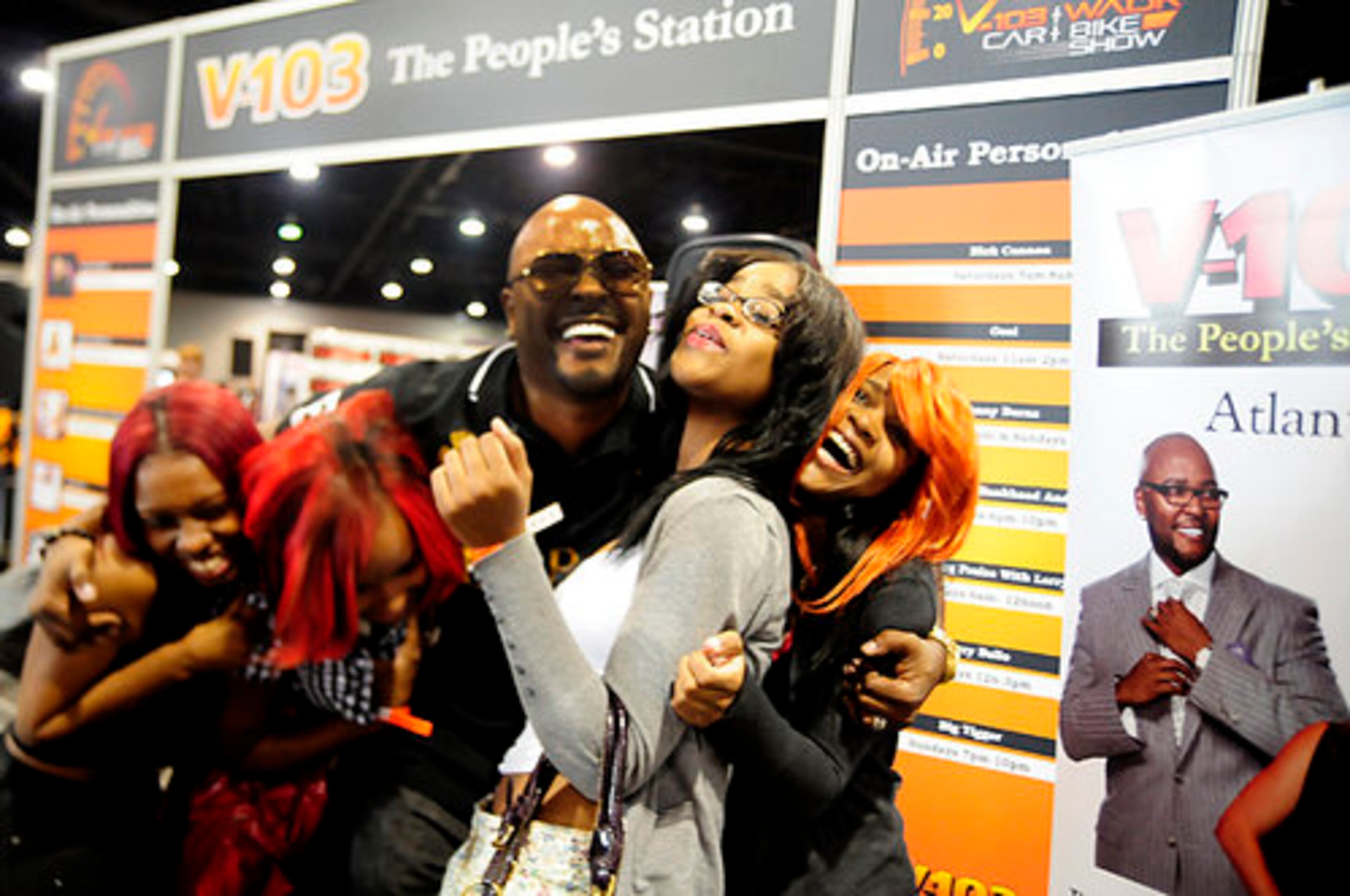 Malexus Davis, Sharita Davis, Kenyatta Cunningham and Felisha Davis get close and personal with V103 radio personality Ryan Cameron.