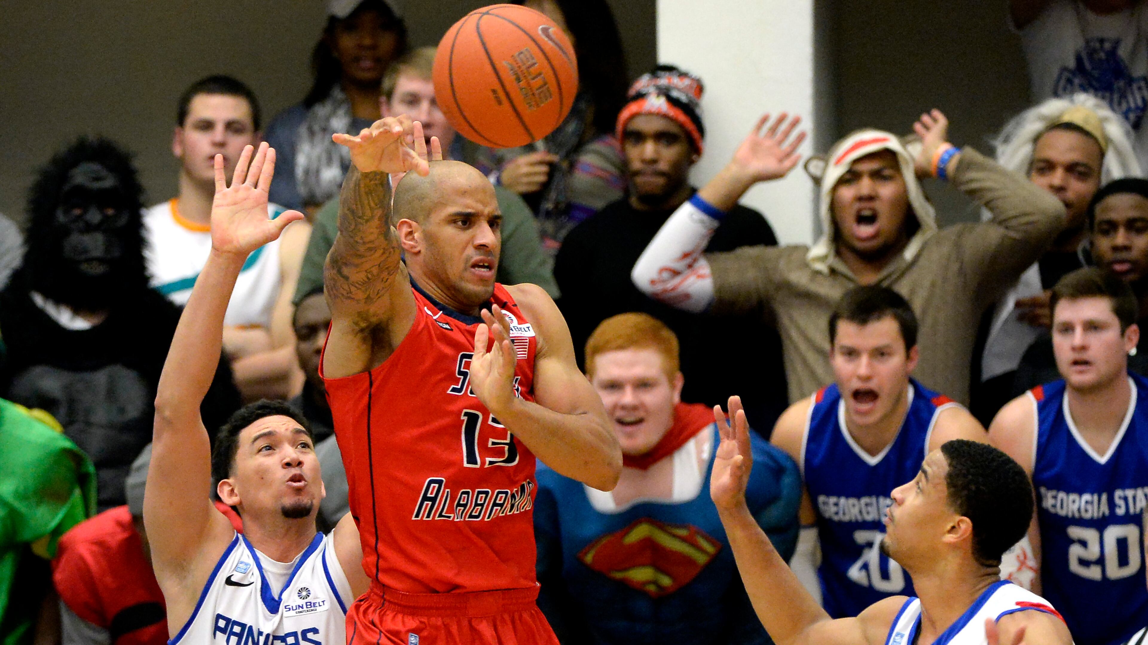 South Alabama forward Mychal Ammons (13) is double teamed by Georgia State's Denny Burguillos (45) and Manny Atkins, right, in the first half of their NCAA college basketball game at the GSU Arena on Monday, Feb. 3, 2014, in Atlanta. Georgia State is looking to extend its school-record winning streak to 13 games. David Tulis / AJC Special