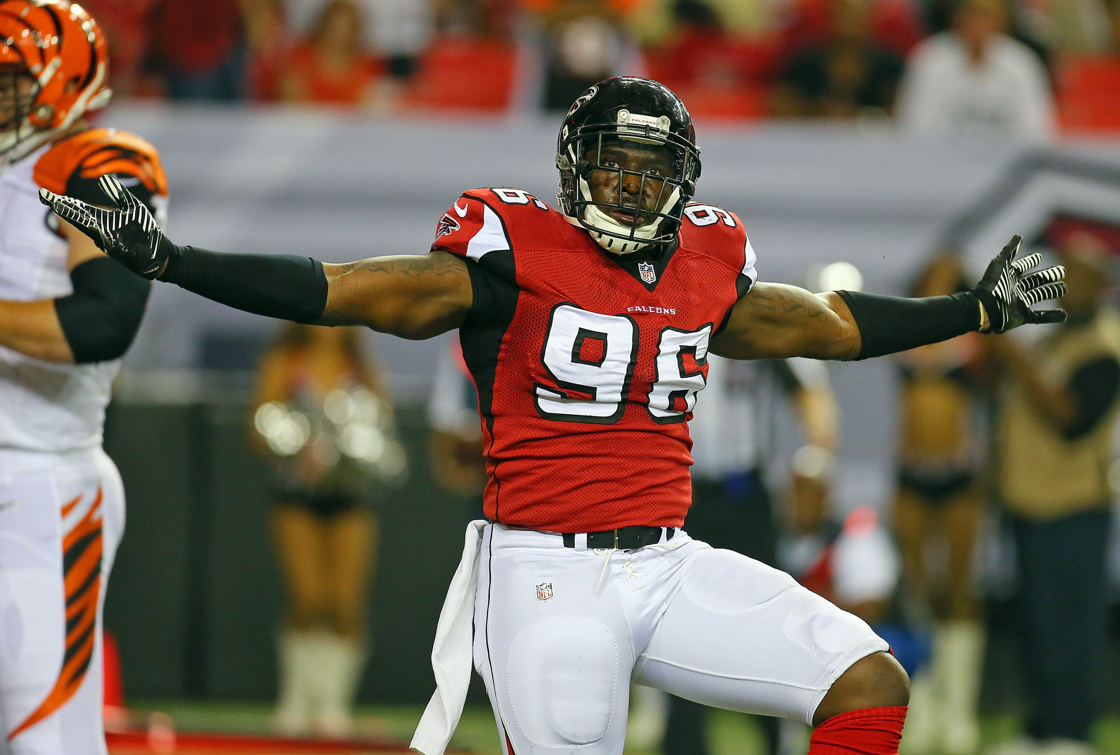 Falcons defensive end Jonathan Massaquoi reacts to taking down Bengals quarterback Josh Johnson during the first half of their NFL exhibition game on Thursday, Aug. 8, 2013, in Atlanta.