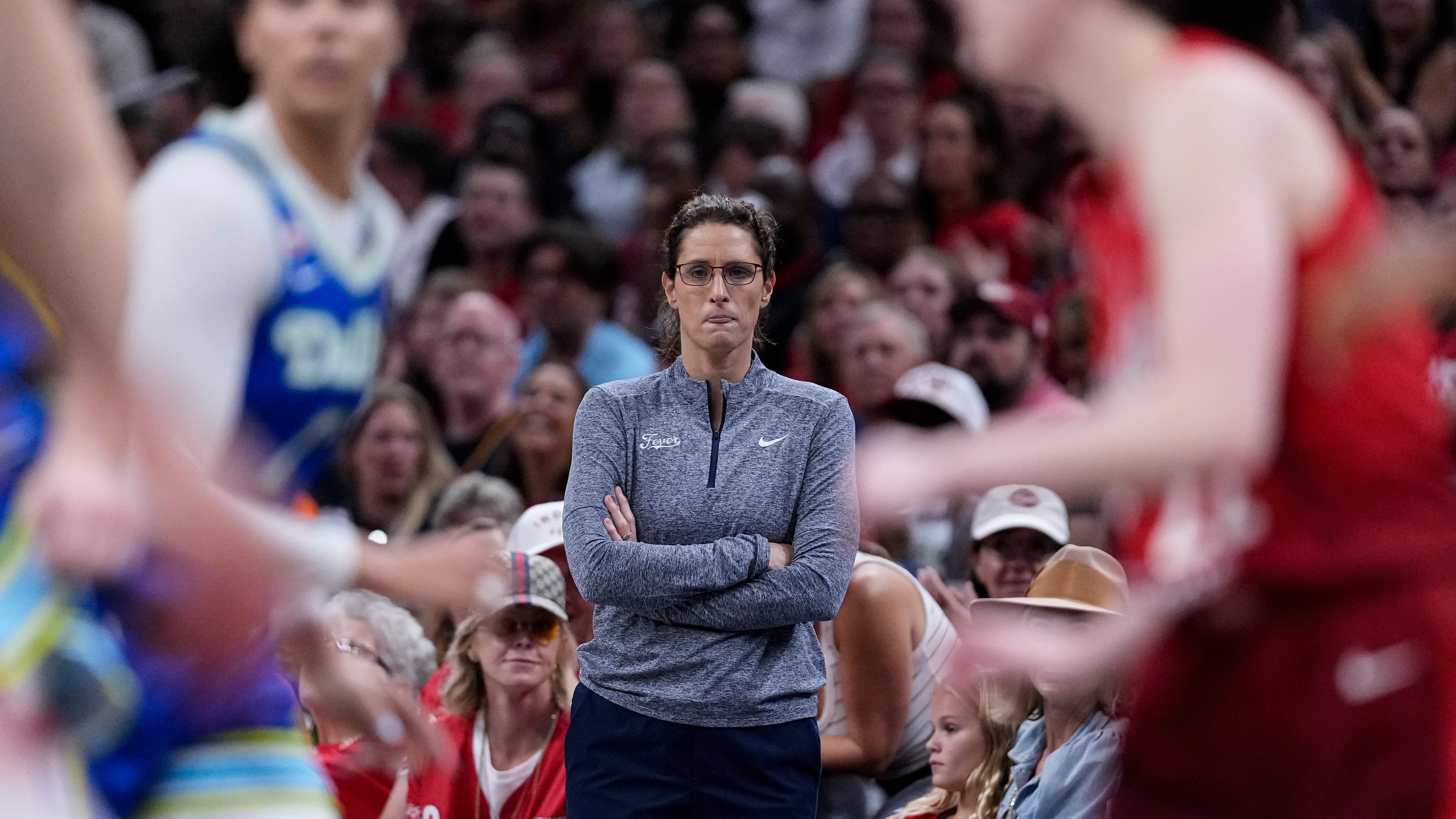 Indiana Fever head coach Stephanie White watches from the sideline in the second half of a WNBA basketball game against the Dallas Wings in Indianapolis, Friday, Aug. 14, 2026. (AP Photo/Michael Conroy)