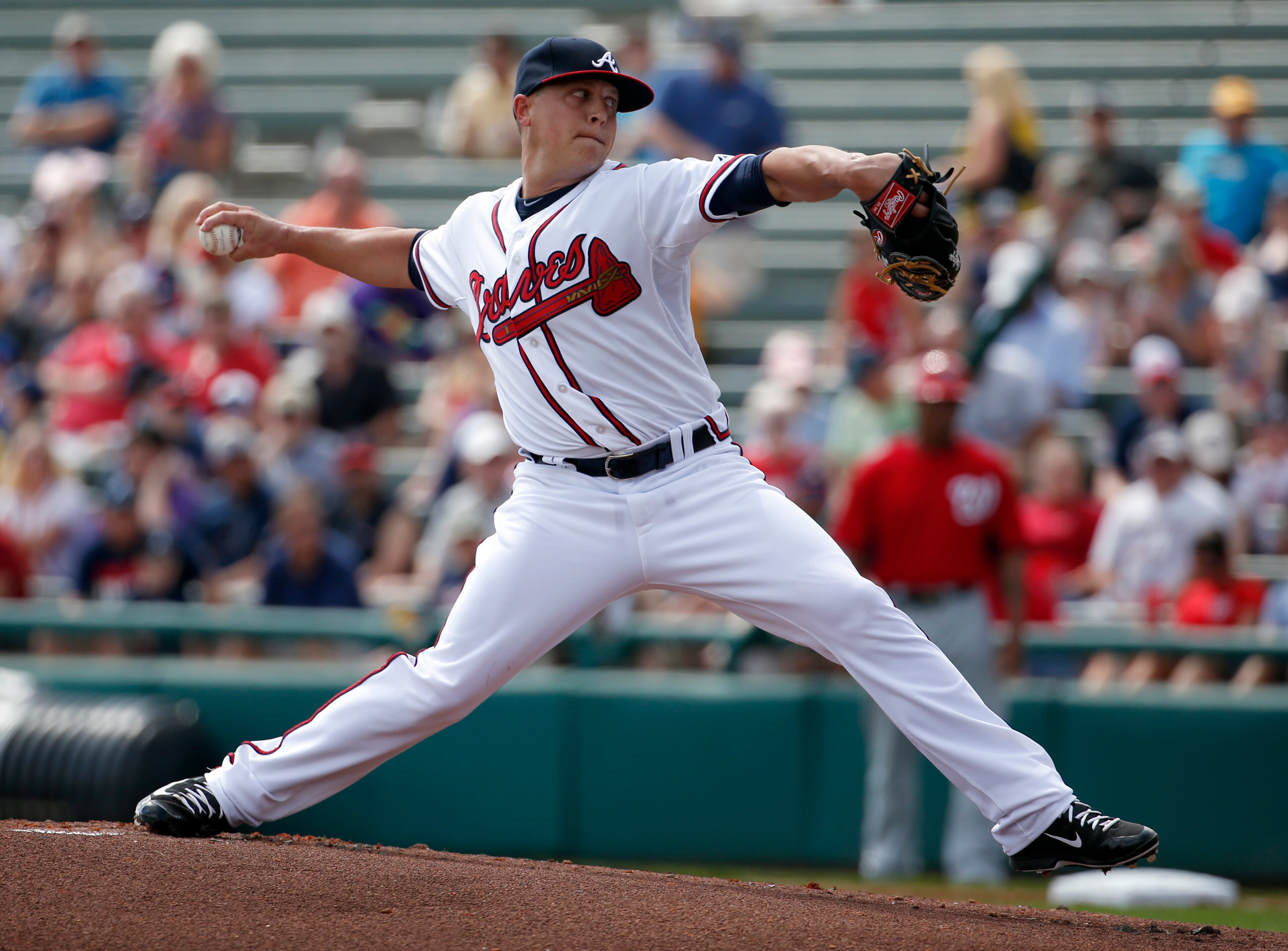 Atlanta Braves starting pitcher Kris Medlen (54) throws in the first inning of a spring exhibition baseball game against the Washington Nationals, Tuesday, March 4, 2014, in Kissimmee, Fla.