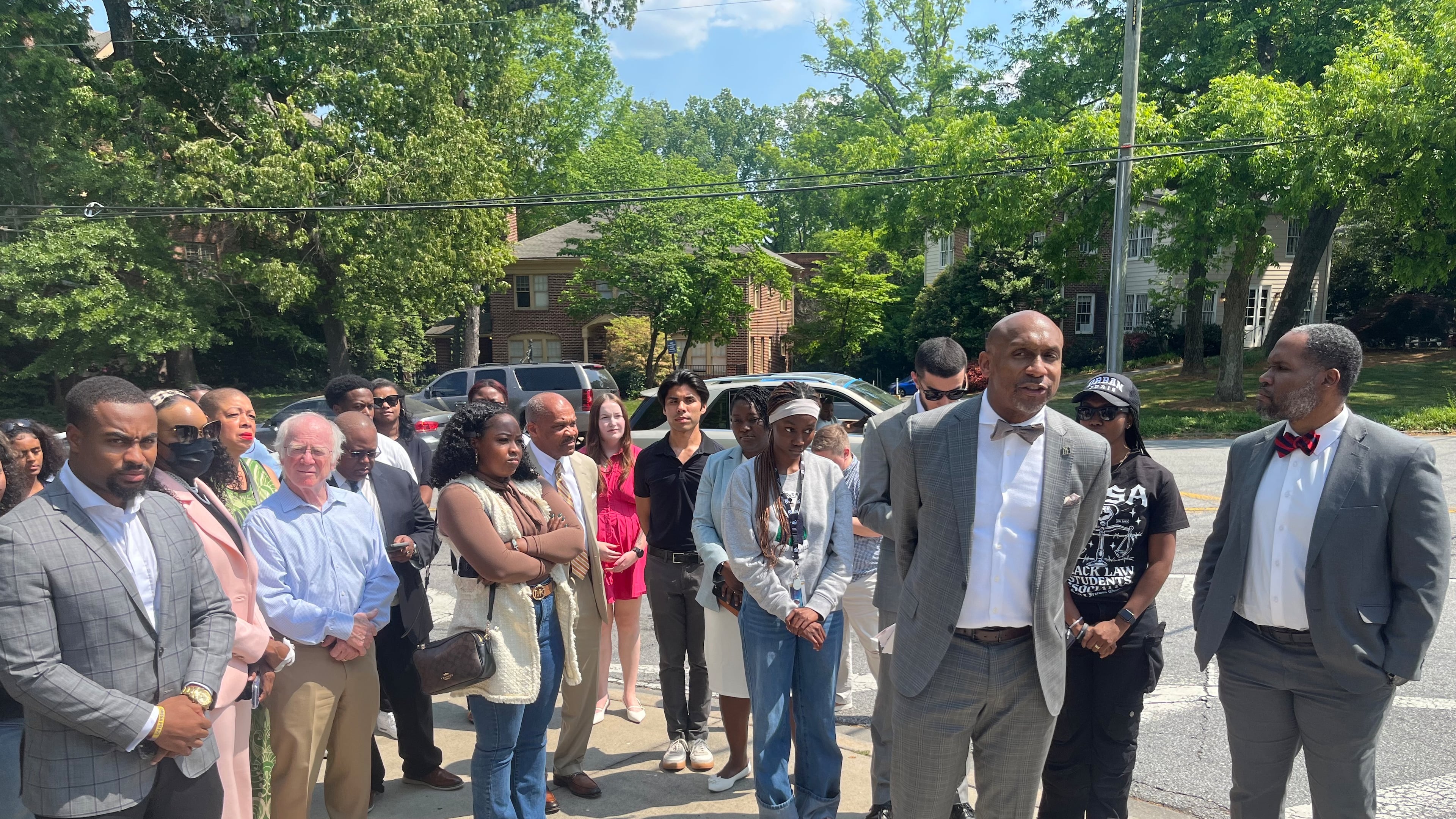 Local attorneys stood outside of the law school at Emory University on Thursday, April 23, 2026, in a show of solidarity with students after a classmate was banned from campus for allegedly writing threatening emails and disturbing social media posts. (Jason Armesto/AJC)