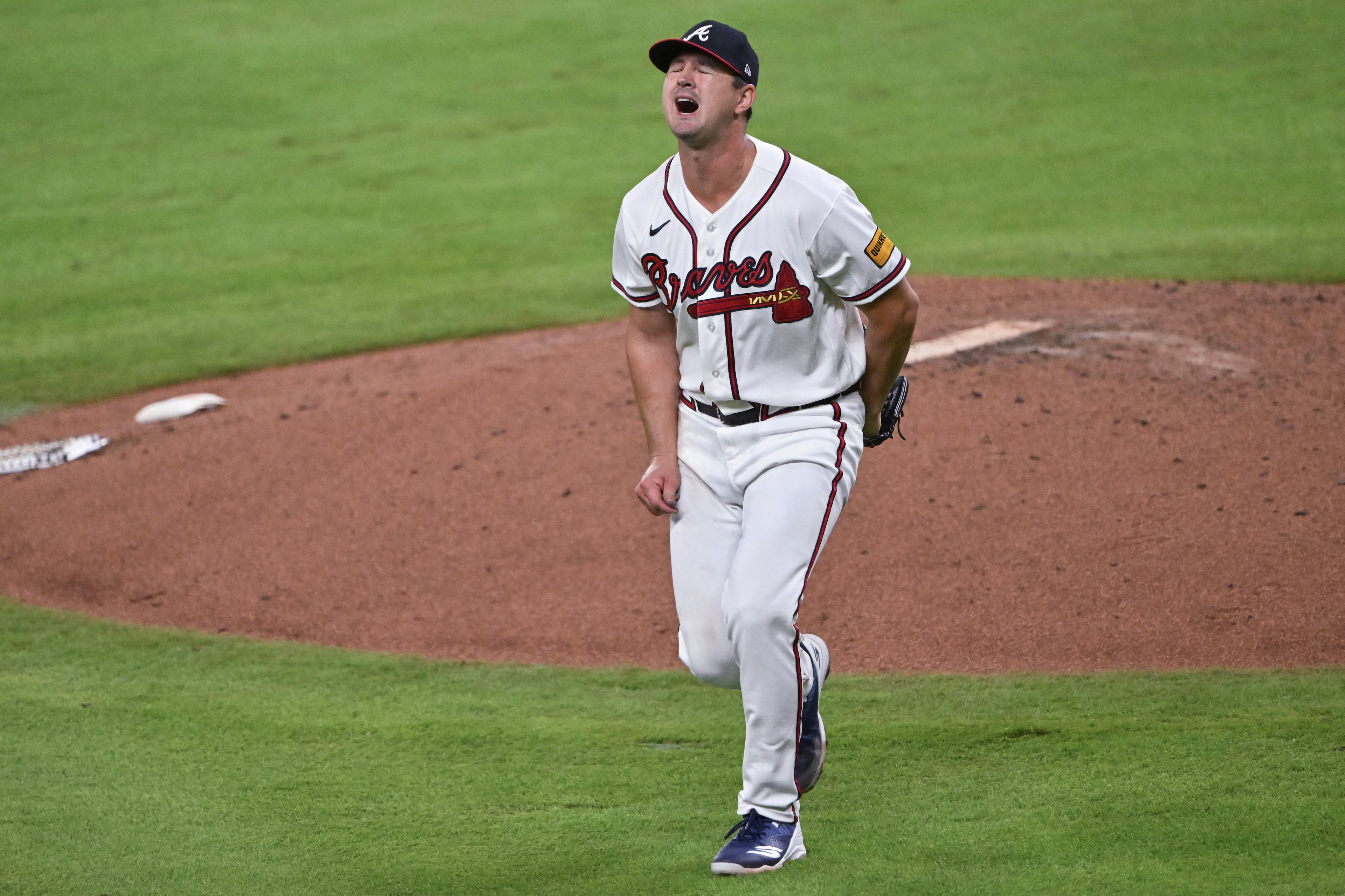 Atlanta Braves pitcher Tyler Mahle reacts after missing a ground ball hit by Los Angeles Dodgers' Kyle Tucker during the fifth inning of Game 4 of the MLB National League Division Series between the Atlanta Braves and the Los Angeles Dodgers, Wednesday, Oct. 7, 2026, in Atlanta. (Hyosub Shin/AJC)