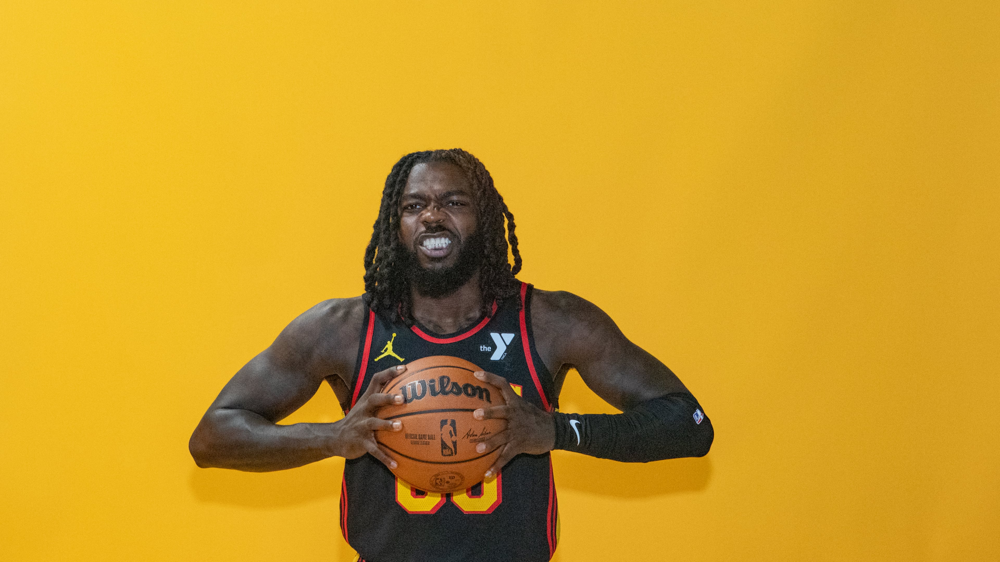 Hawks player Kevon Harris, #00, poses for photos during media day. Hawks media day takes place on Monday, Sept 30, 2024 where media outlets including the Associated Press, Getty, NBA and many others gather to take photos, conduct interviews and gather footage. (Jenni Girtman for The Atlanta Journal-Constitution)