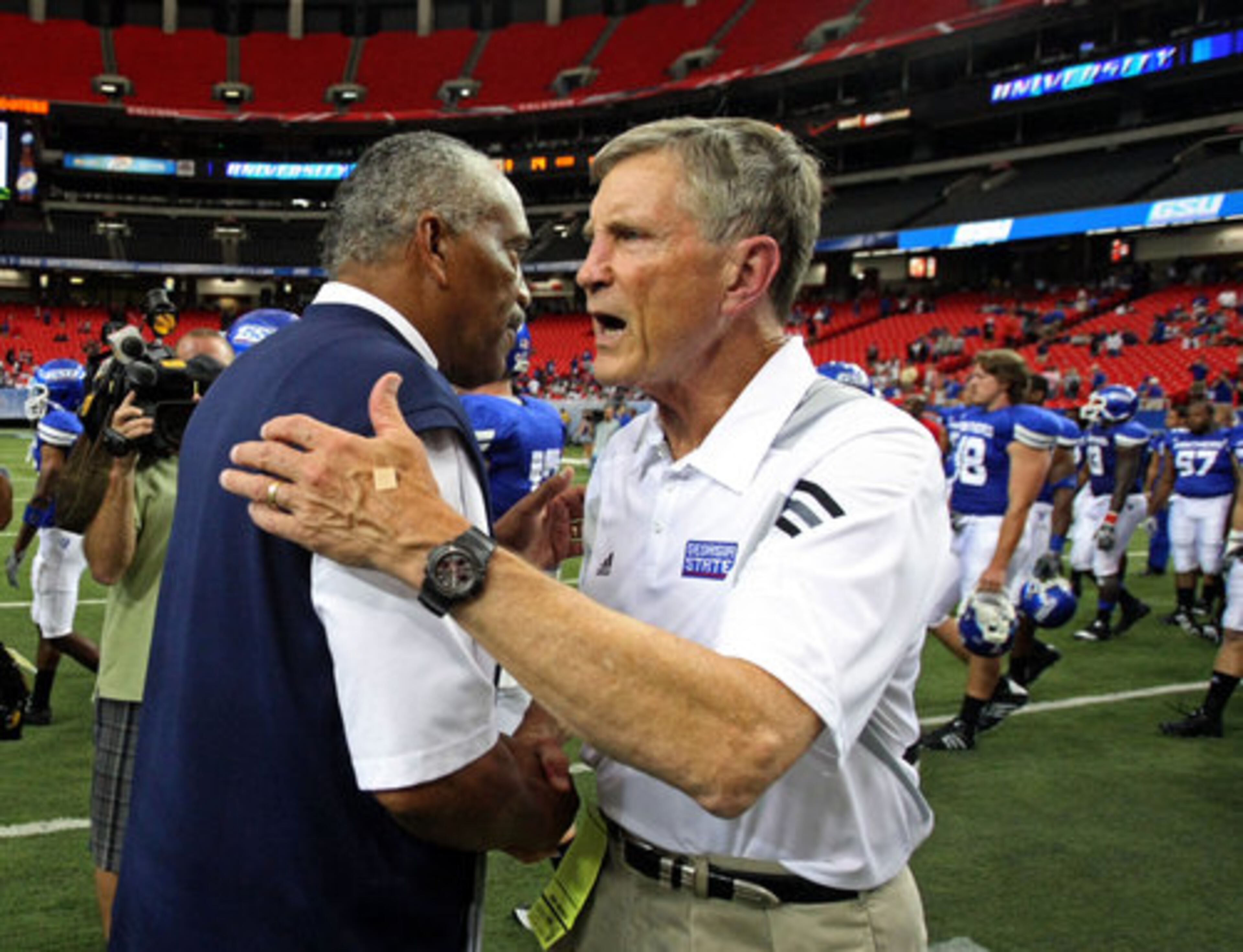 Georgia State University coach Bill Curry greets Lambuth coach Ron Dickerson, left, after GSU's first ever loss to Lambuth 23-14 Saturday afternoon at the Georgia Dome in Atlanta, Ga., Sept. 11, 2010.