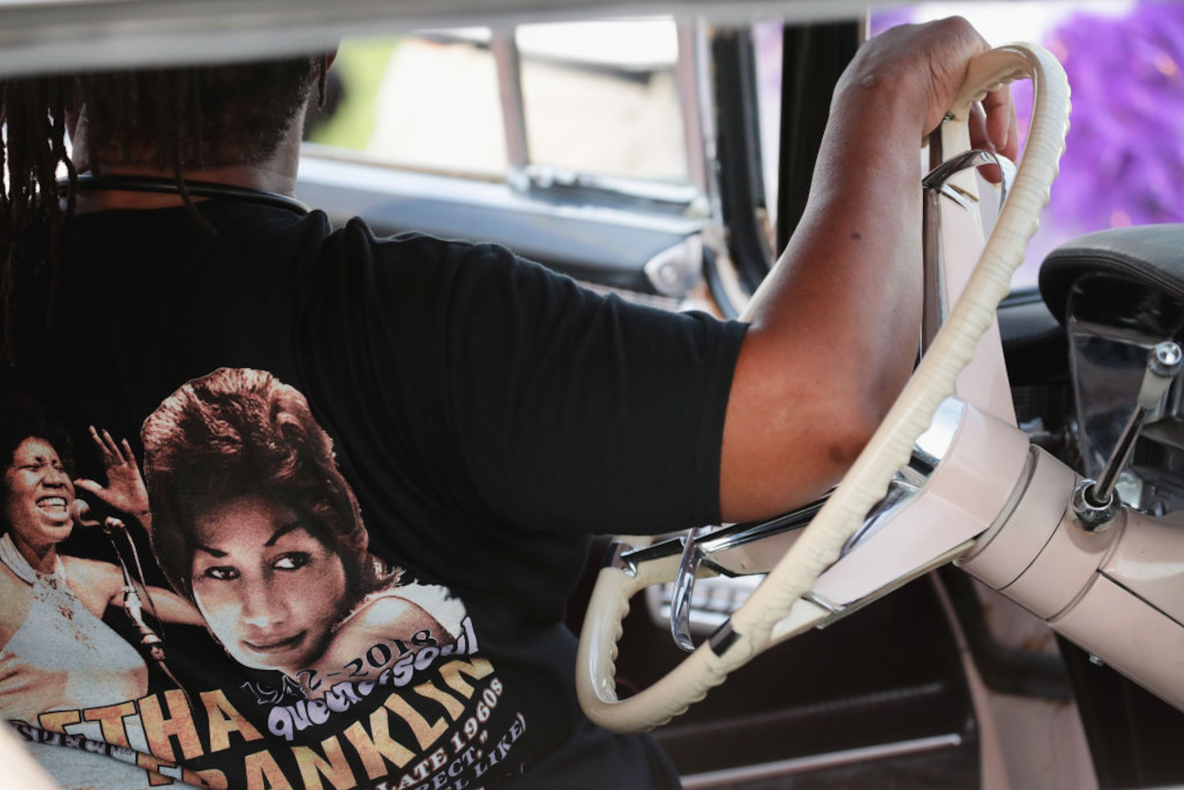 DETROIT, MI - AUGUST 28: A fan of Aretha Franklin sits inside a vintage Cadillac after viewing the soul music legend's body as it lies in repose at the Charles H. Wright Museum of African-American History on August 28, 2018 in Detroit, Michigan. Franklin will lie in repose at the museum today and tomorrow for the public to pay their respects. Franklin's funeral will be held Friday at Greater Grace Temple. (Photo by Scott Olson/Getty Images)