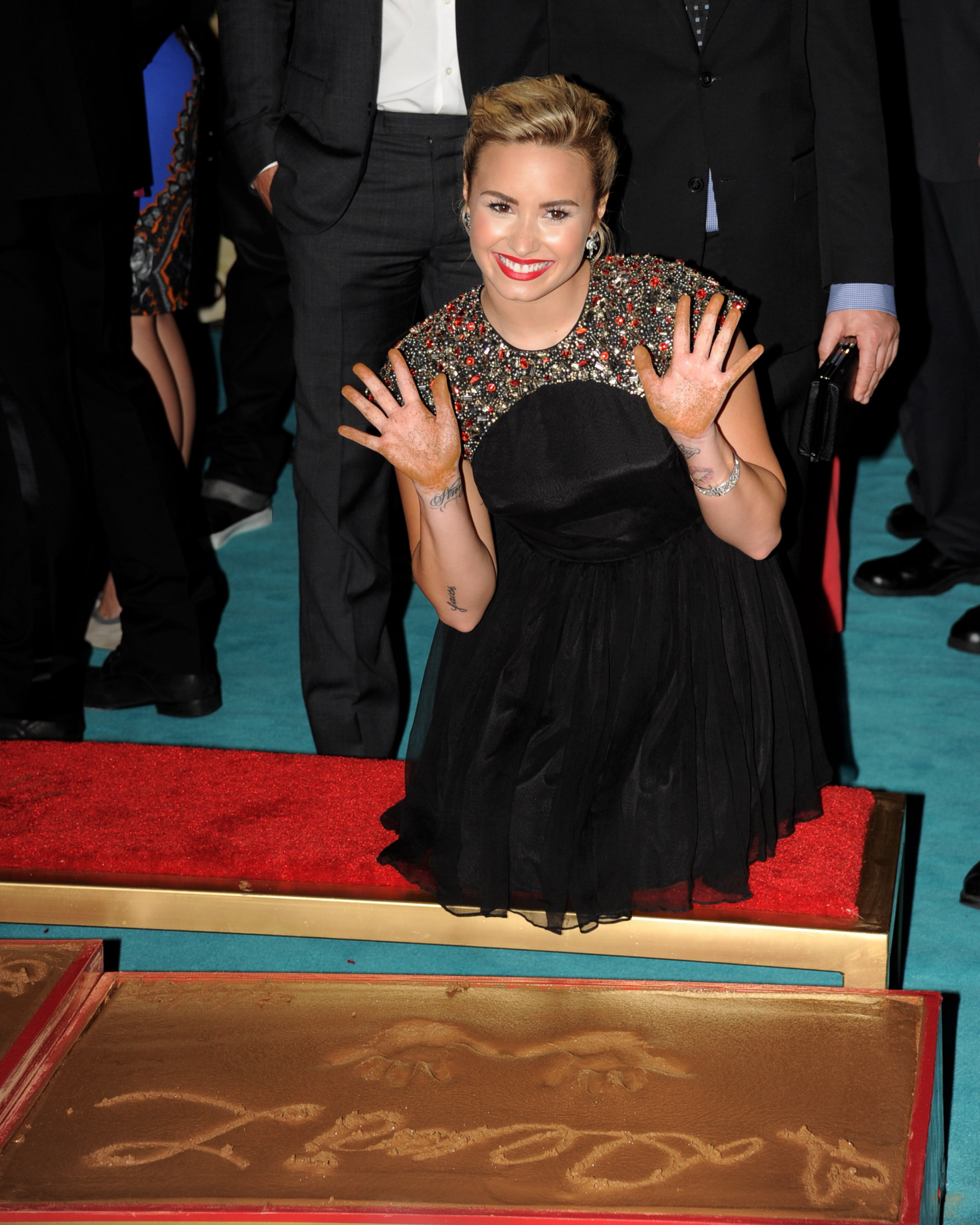 LOS ANGELES, CA - SEPTEMBER 11: Singer Demi Lovato appears at the premiere of Fox's "The X Factor" Season 2 and handprint ceremony at the Chinese Theatre on September 11, 2012 in Los Angeles, California. (Photo by Kevin Winter/Getty Images)