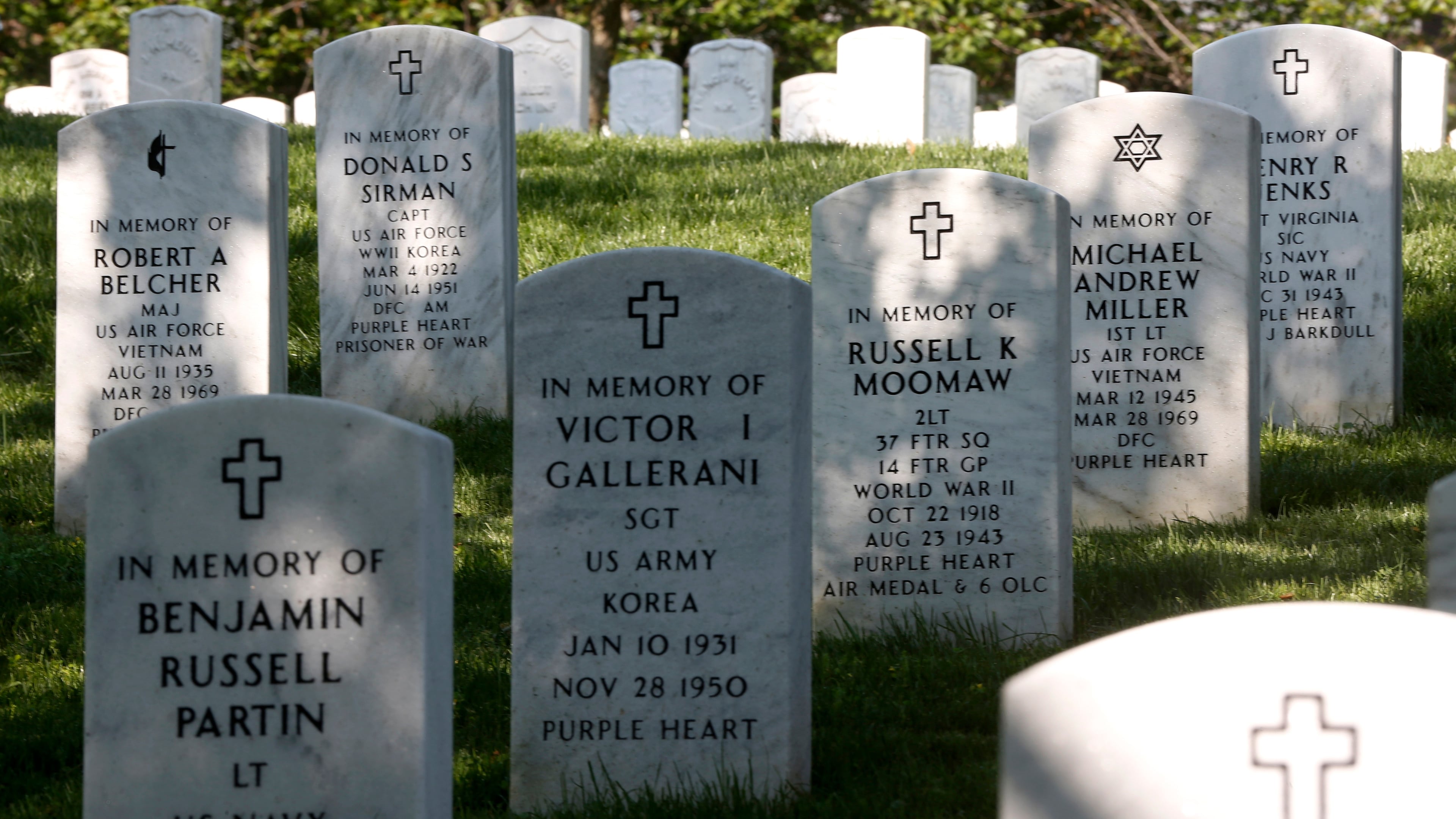 FILE - Rows of gravestones stand at the Arlington National Cemetery in Arlington, Va., May 13, 2014. (AP Photo/Charles Dharapak, File)