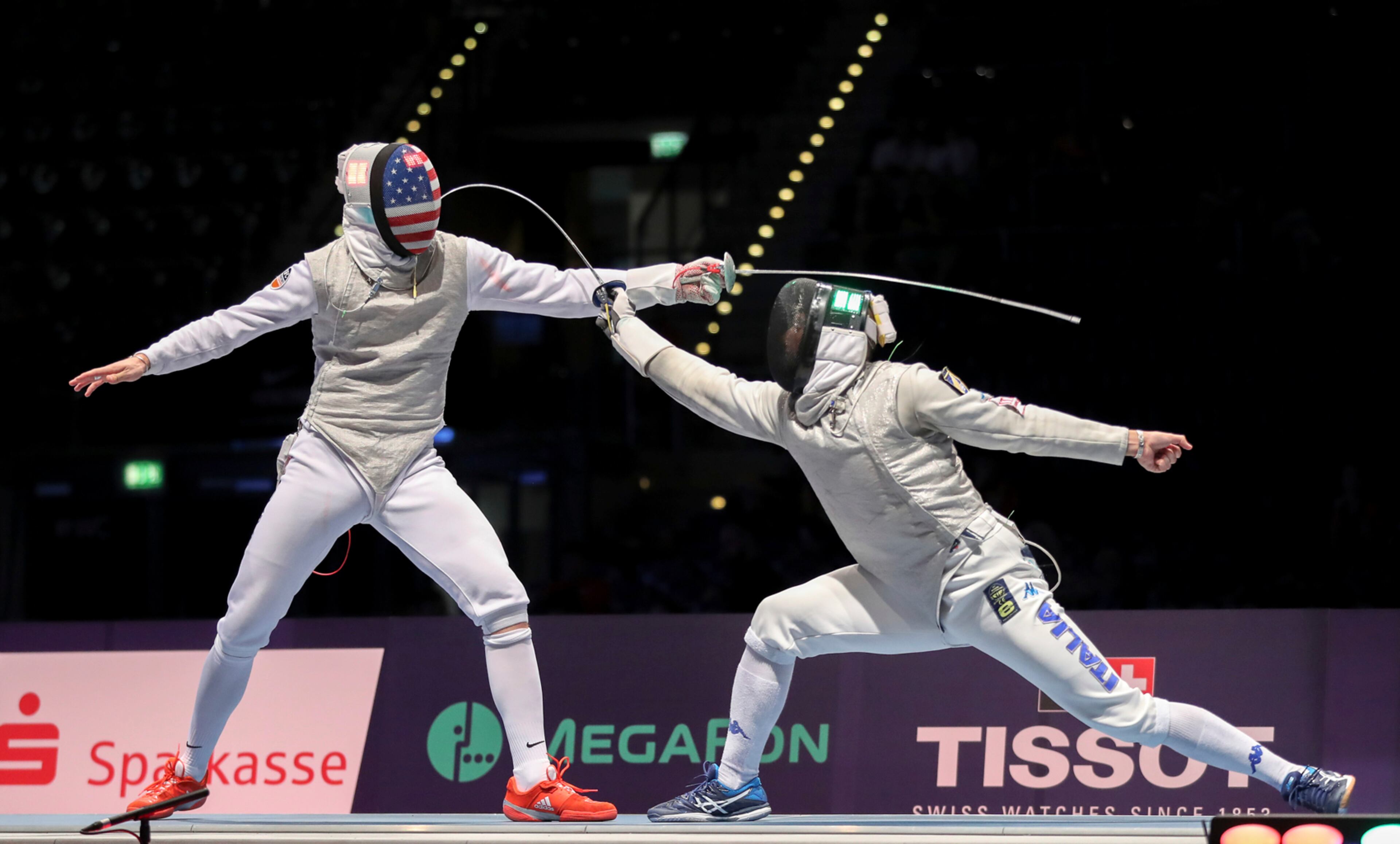 The foil fencer Race Imboden, left, of the US competes against Alessio Foconi of Italy during the men's team foil final at the World Fencing Championships in Leipzig, Germany, Wednesday, July 26, 2017. (Jan Woitas/dpa via AP)