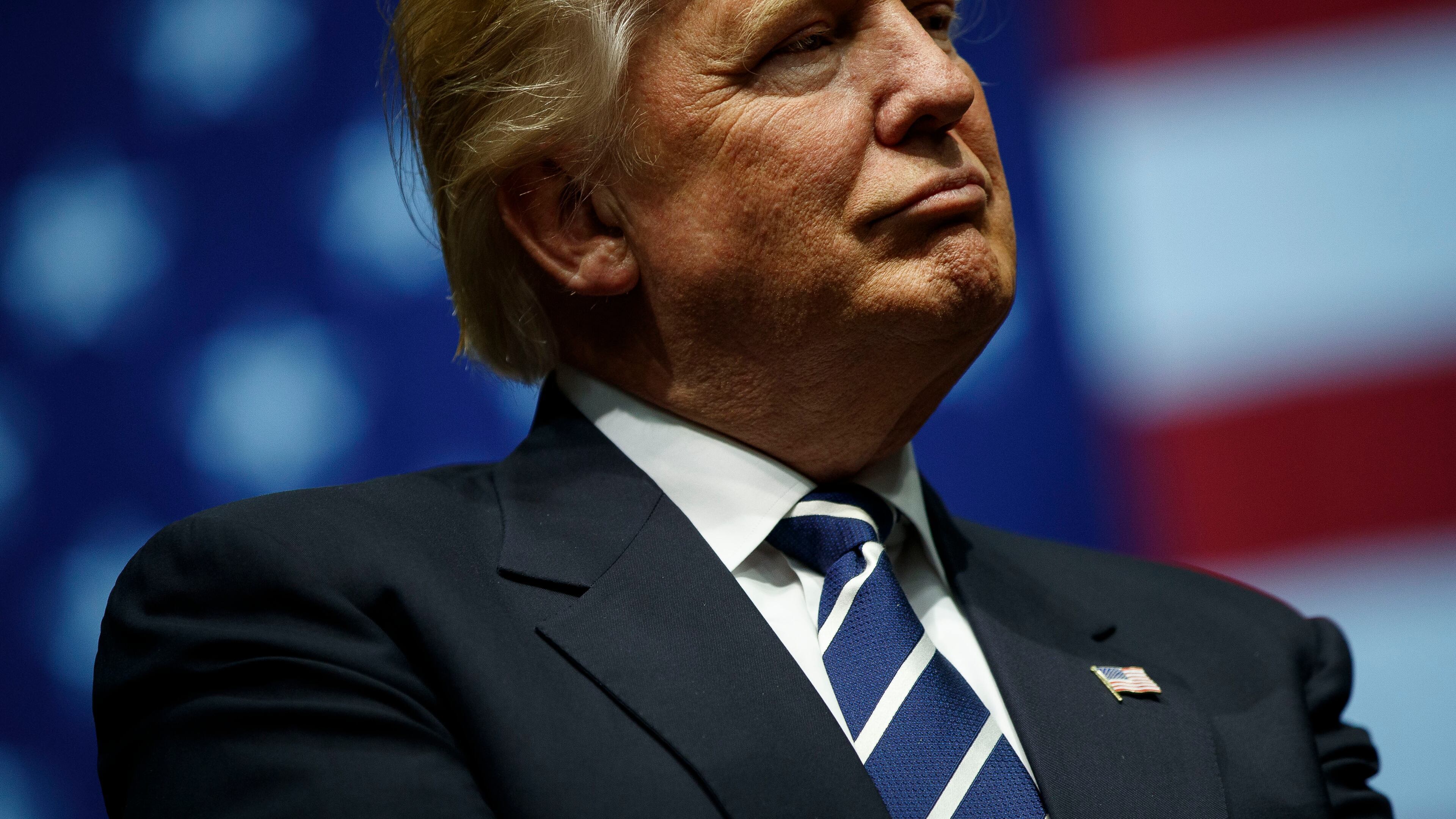 GRAND RAPIDS, MI - DECEMBER 9: President-elect Donald Trump looks on during at the DeltaPlex Arena, December 9, 2016 in Grand Rapids, Michigan, during his victory tour across the country. (Photo by Drew Angerer/Getty Images)