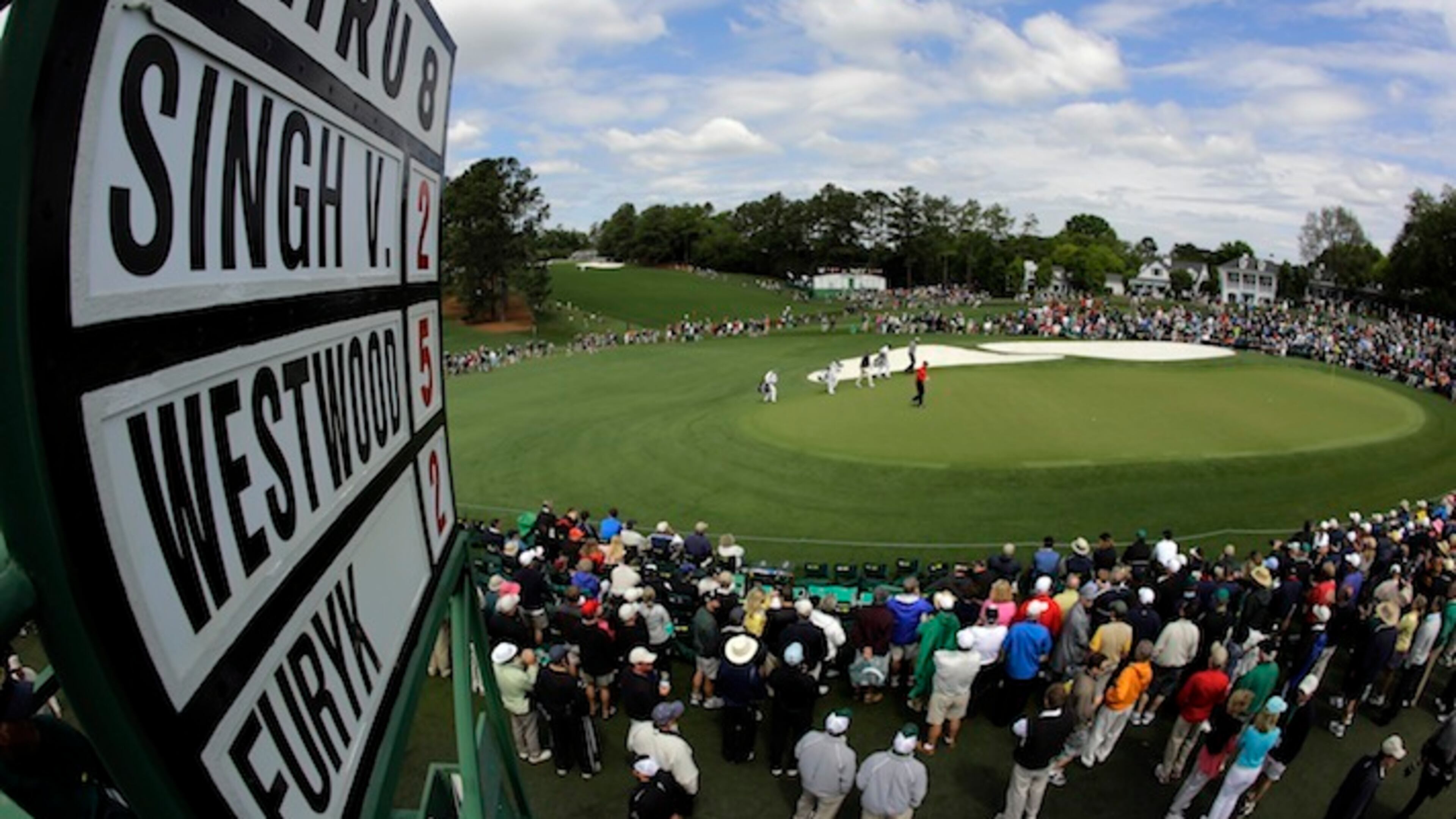 Lee Westwood, of England, Vijay Singh, of Fiji, and Jim Furyk walk up to the ninth green during the second round the Masters golf tournament Friday, April 6, 2012, in Augusta, Ga.