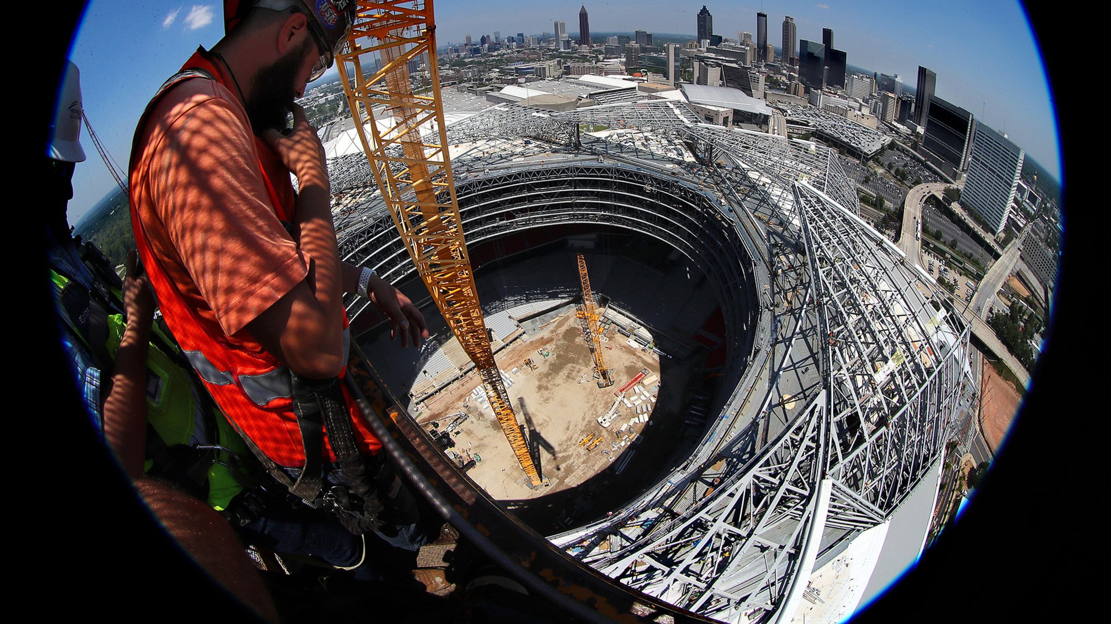 Demand for construction workers seemed to peak in the past several years when they were needed for building two huge stadiums and a number of high-rises. Here, a worker takes in the view from the the top of Falcons Mercedes-Benz Stadium during the final stages of construction. Curtis Compton/ccompton@ajc.com
