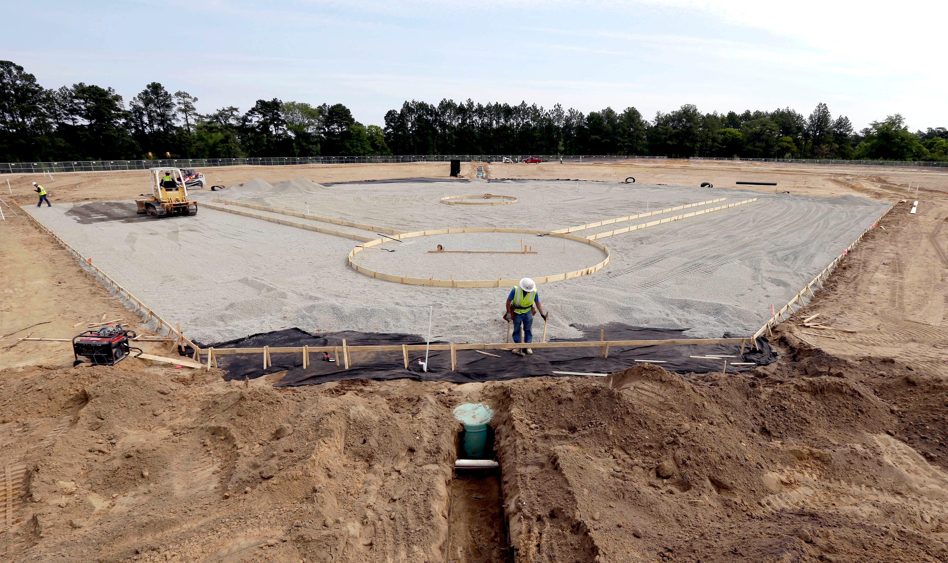 Contractors install a baseball field at Fort Bragg, N.C. . (AP Photo/Gerry Broome)