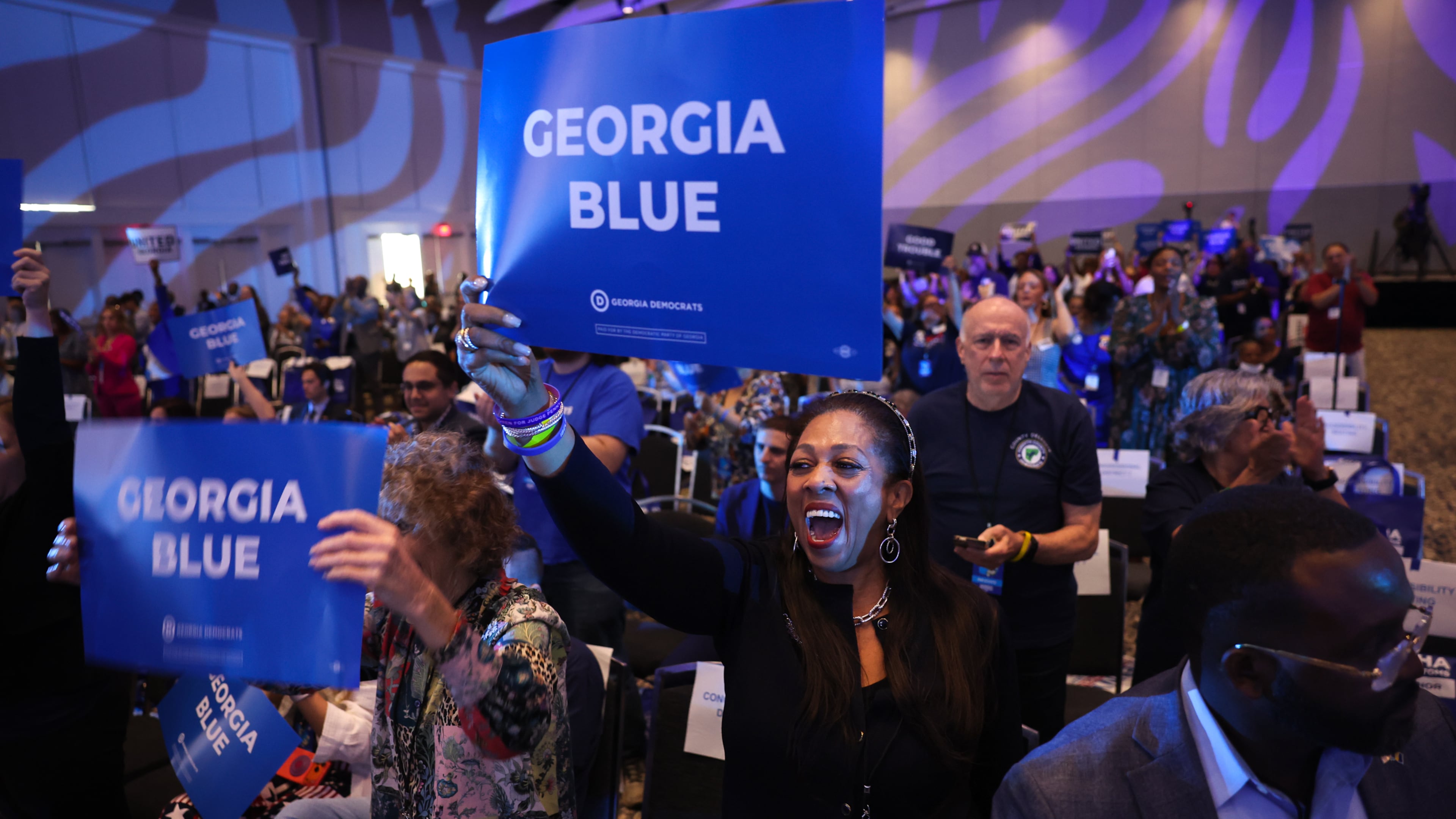 Cassandra Littlejohn cheers at the Georgia Democratic Convention at the Savannah Convention Center in Savannah on Saturday, Aug. 1, 2026. (Arvin Temkar/AJC)