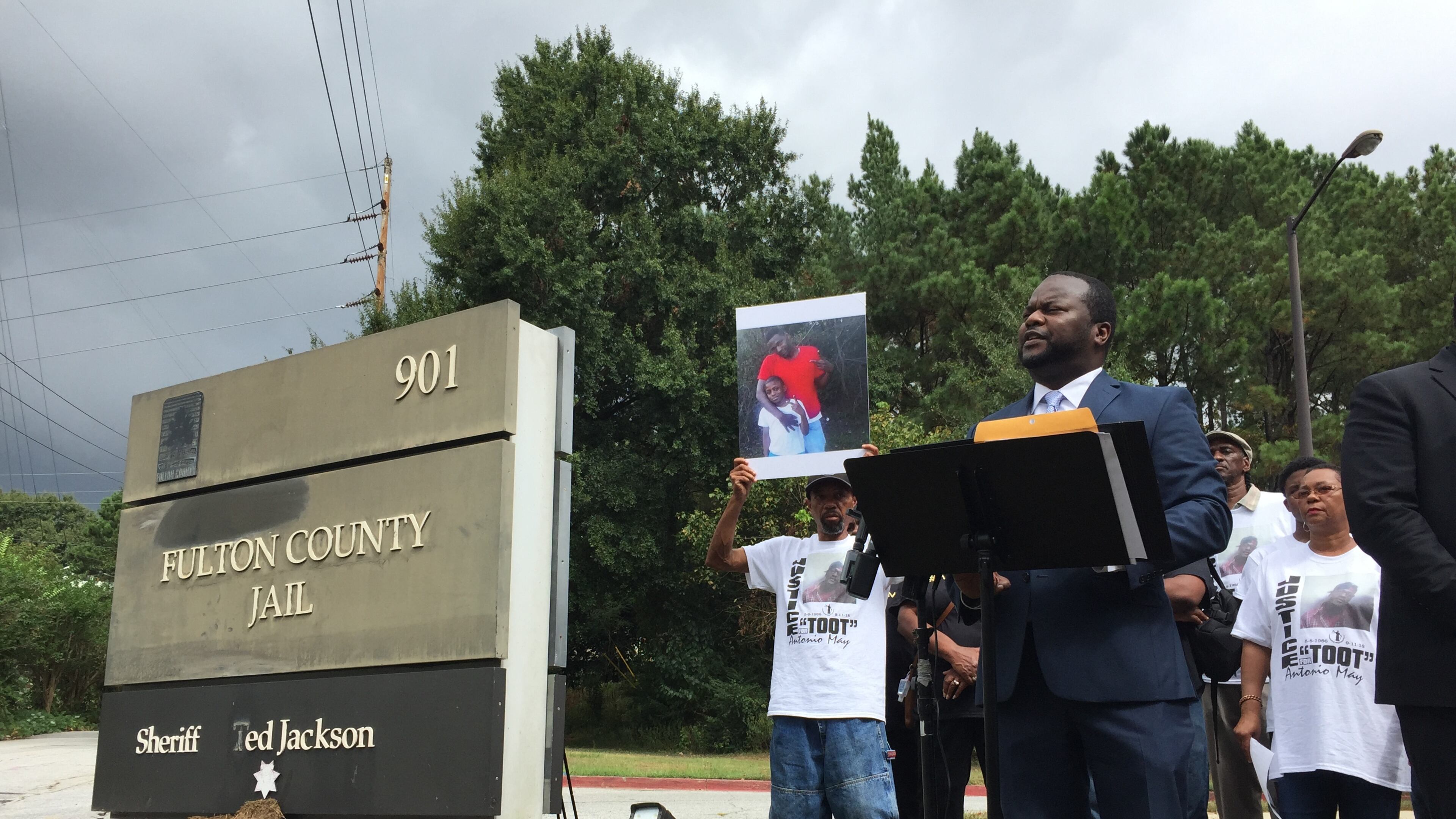 Attorney Michael Harper speaks at a news conference Tuesday, calling on the Fulton County district attorney's office to launch an investigation into the death of Antonio May.