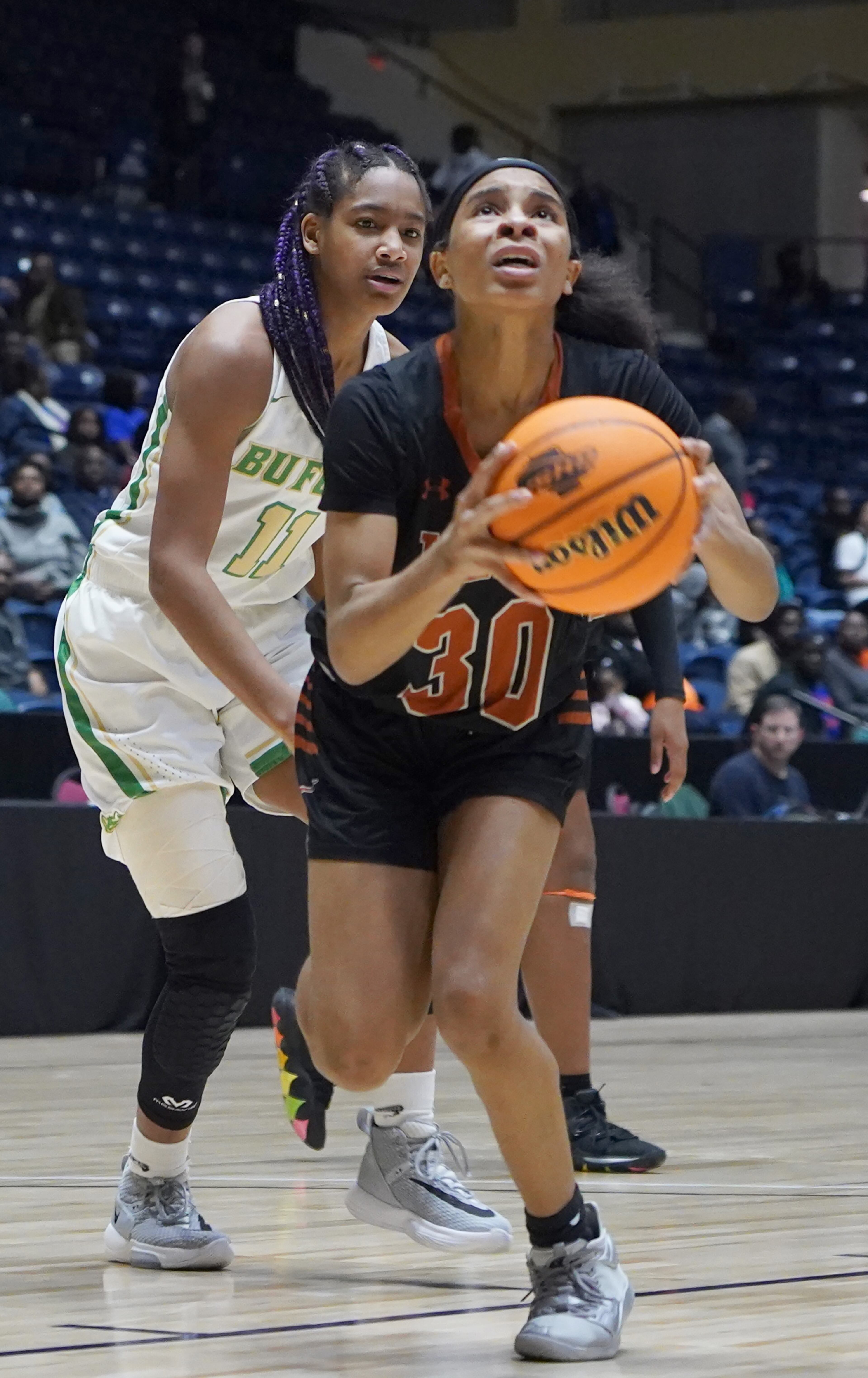 Kell's Cyrstal Henderson (30) drives past Buford's Courtney Martin in the second half at the Class AAAA girls title basketball game at the Macon Centreplex, Friday March 6, 2020, in Macon. Tami Chappell for the Atlanta Journal Constitution