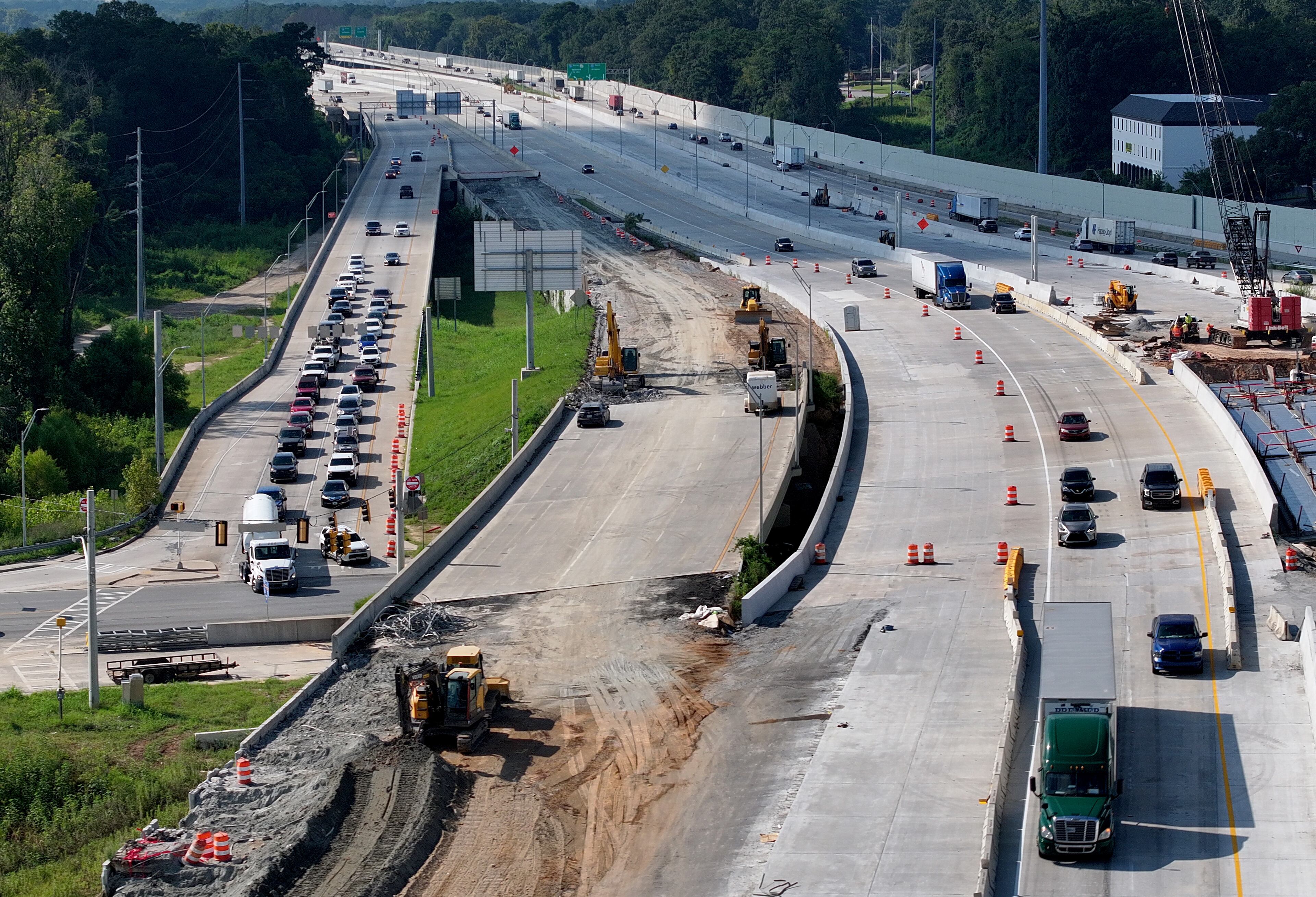 Traffic exiting I-16, at left, at Spring Street in downtown Macon on a recent afternoon. The off-ramp, long a chokepoint for commuters, has been reconfigured amid the decade-plus-long I-16/I-75 interchange project. (Hyosub Shin / AJC)