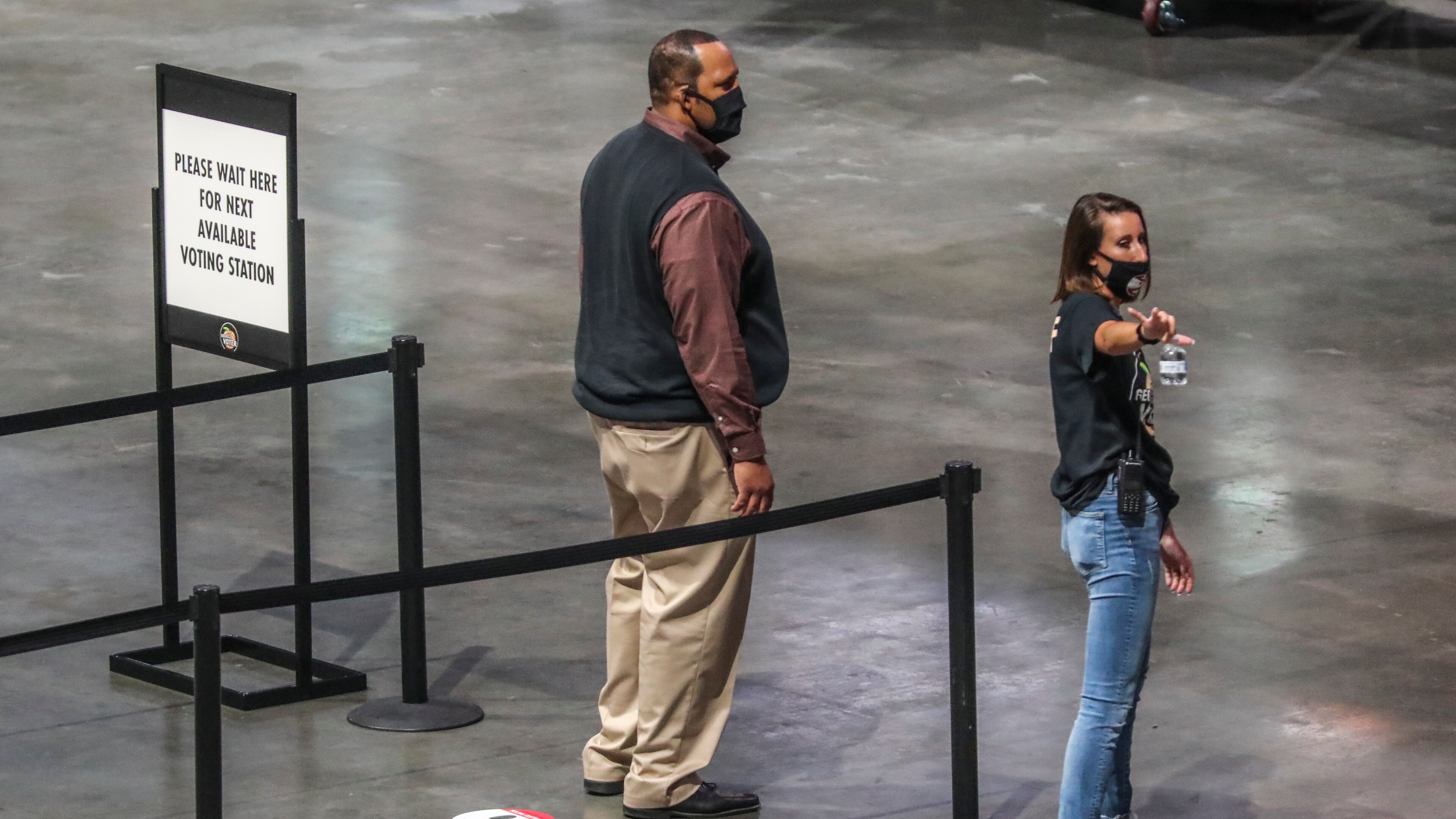 July 20, 2020 Atlanta: Early voting for Georgia’s runoff elections began Monday, including at a giant polling place on the Atlanta Hawks’ home court, State Farm Arena (shown here). The runoffs will decide races left unsettled after last month’s primaries, including for the U.S. House of Representatives, Fulton County district attorney, the Georgia General Assembly and superior courts. Three weeks of in-person early voting is available across Georgia, but the biggest voting site in state history is inside State Farm Arena in downtown Atlanta. The arena, equipped with 100 voting stations, is designed to ease long lines and provide a central location available to any of Fulton’s 814,000 registered voters. Eighteen other early voting sites are also available in Fulton. The arena transformed into a voting site after some voters waited for hours to cast their ballots in June because of social distancing requirements, precinct closures, poll worker shortages and difficulties operating Georgia’s new voting equipment. Election officials say they’re making changes to avoid similar problems again. They’re improving poll worker training, identifying overcrowded precincts and adding tech support staff at voting locations. After record turnout in the June 9 primary, with nearly 2.4 million voters, fewer people are expected to participate in the runoff. JOHN SPINK/JSPINK@AJC.COM