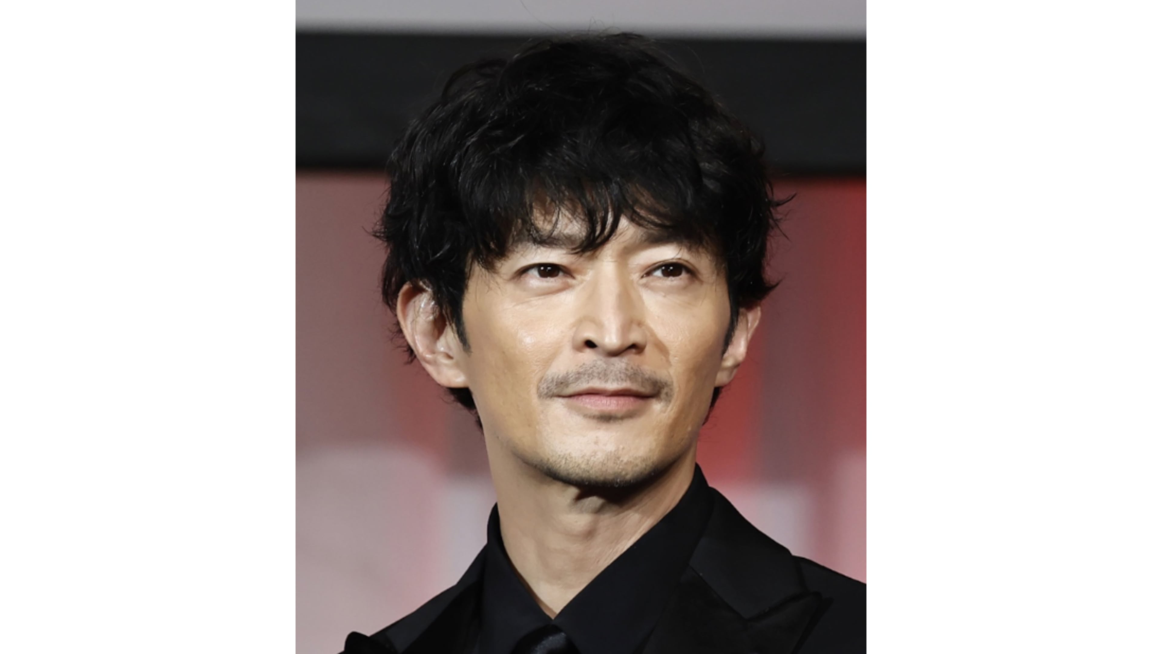 Kenjiro Tsuda, a Japanese actor is seen on a stage, November, 2024, in Tokyo, Japan. (Kyodo News via AP)
