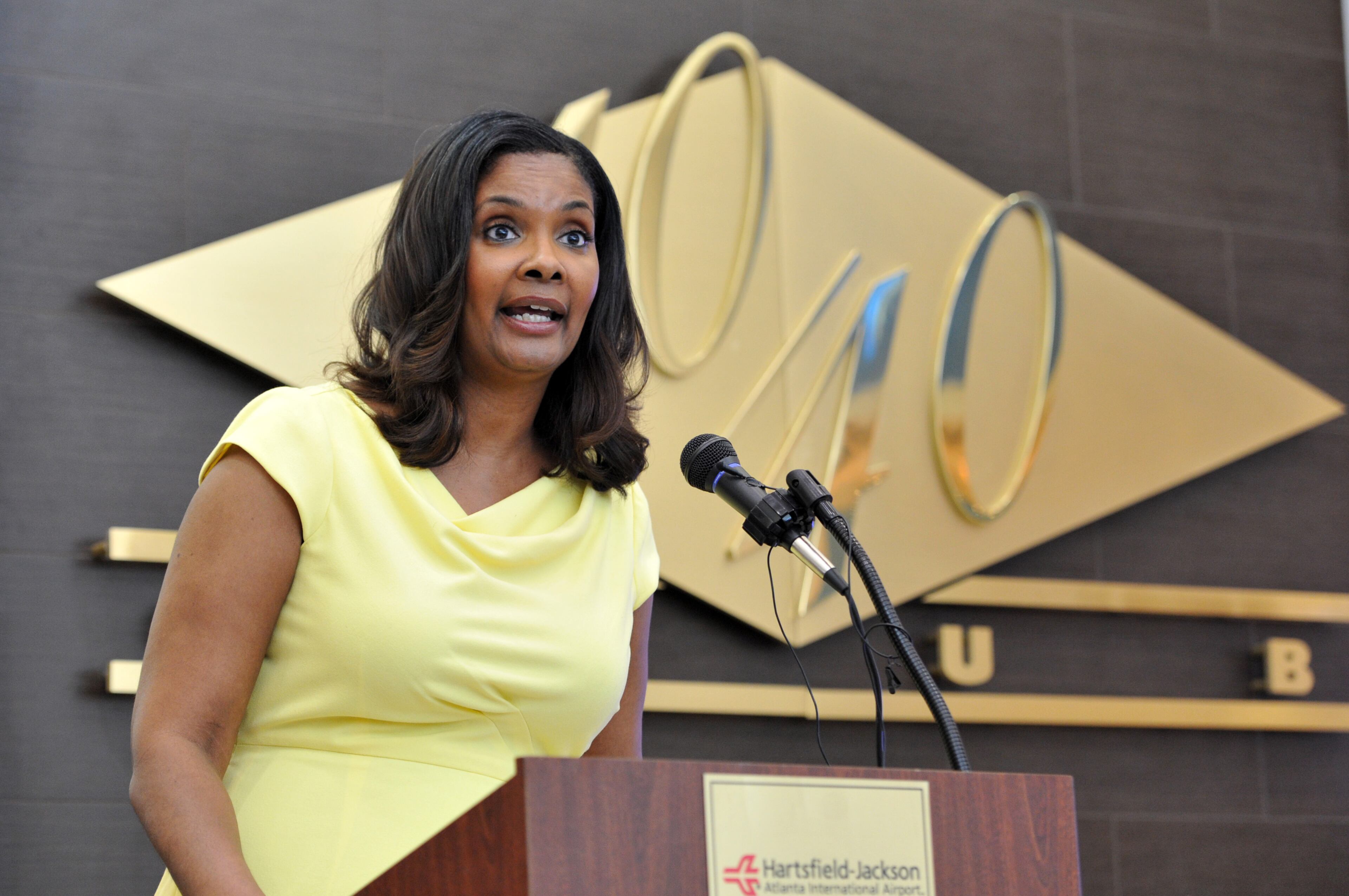 SECONDARY June 24, 2014 Atlanta - Vivica Brown, Interim Assistant General Manager for Hartsfield-Jackson, speaks during a grand opening celebration of Concourse D at the Hartsfield-Jackson Atlanta International Airport on Tuesday, June 24, 2014. Hartsfield-Jackson and Delaware North celebrate the newest additions to Concourse D, including local favorites GrindHouse Killer Burgers and Yoforia, and national brands 40/40 Club and Food Network Kitchen. HYOSUB SHIN / HSHIN@AJC.COM