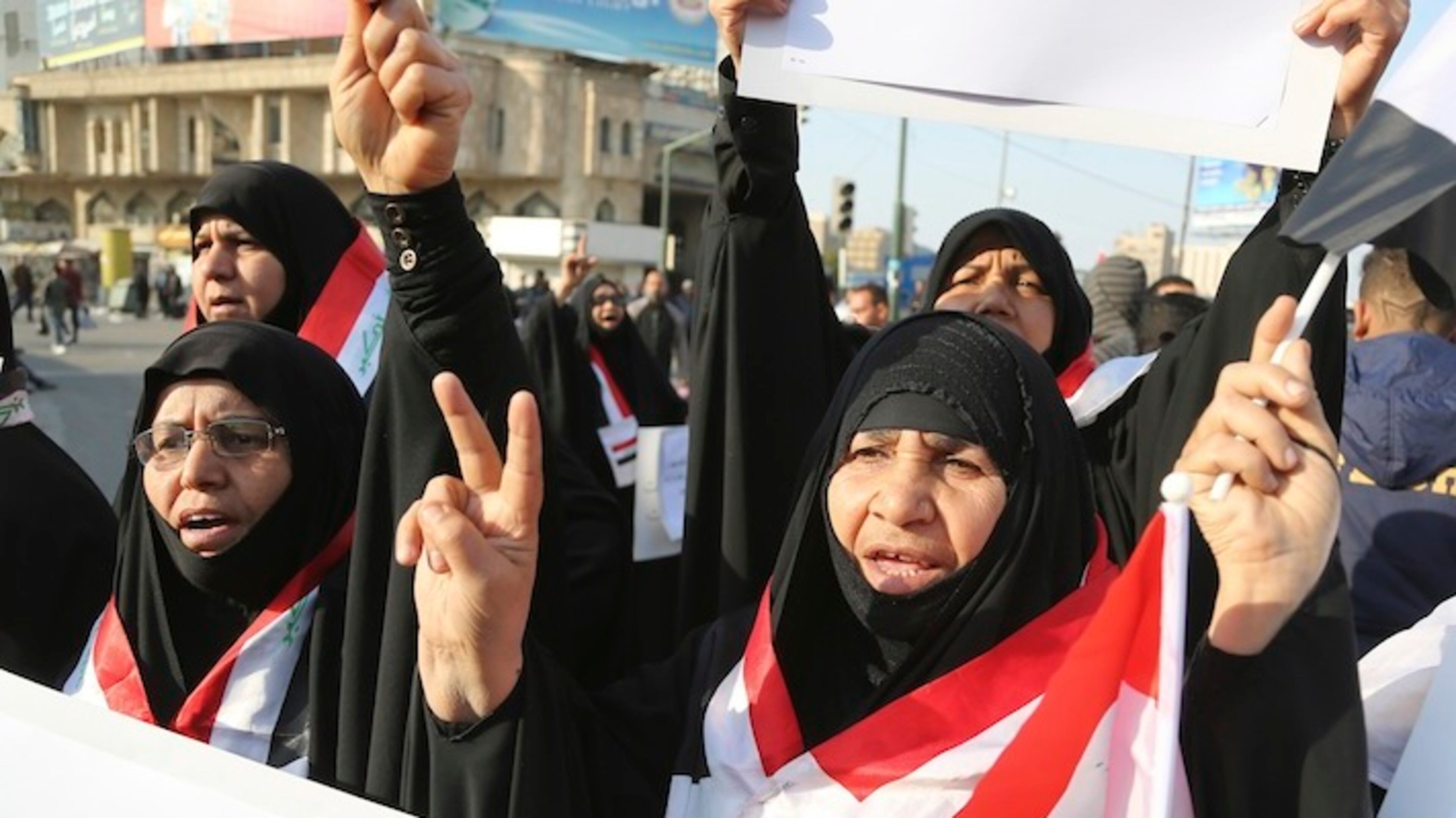 Women followers of Shiite cleric Muqtada al-Sadr chant slogans demanding government reform as they wave national flags during a demonstration in Baghdad, Iraq, Friday, Feb. 10, 2017. Iraq's prime minister, Haider al-Abadi, is trying to contain any backlash amid anger over President Donald Trump's ban on Iraqis traveling to the U.S. and his statements that the U.S. should have taken the country's oil, as well as his hard line against Iran, a close ally of al-Abadi's government. (AP Photo/ Karim Kadim)