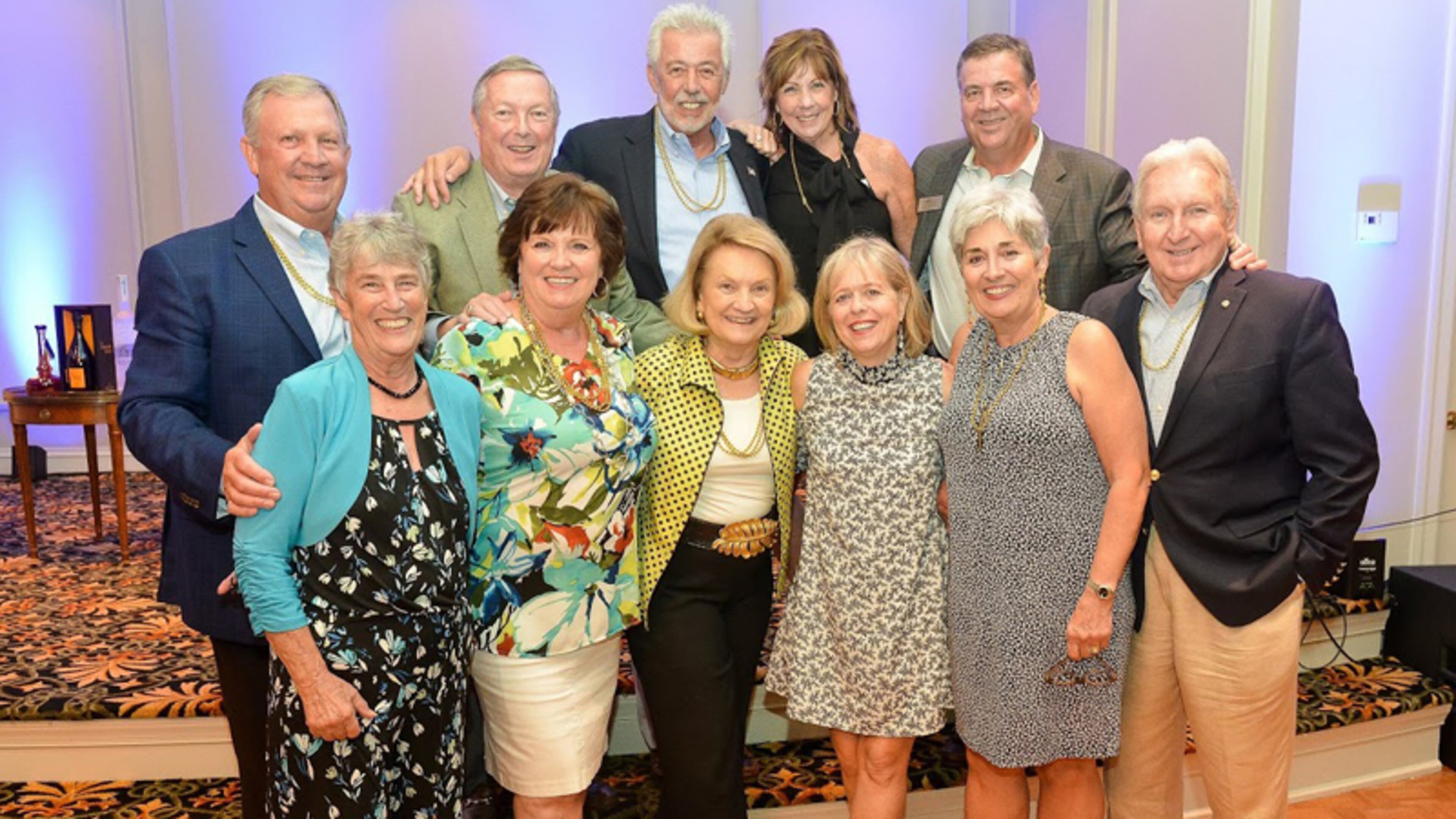 Well wishers join Barbara Duffy (front row, far left), retiring executive director of North Fulton Community Charities, at a farewell fundraiser: (back row) Chris Good, David Reddick, Neil Moulton, Mary Good, John Carpentier; (front row) Duffy, Cheryl Moulton, Anne Reddick, Beth Carpentier, Jeanie Clinkscales, Mickey Deaton. NORTH FULTON COMMUNITY CHARITIES