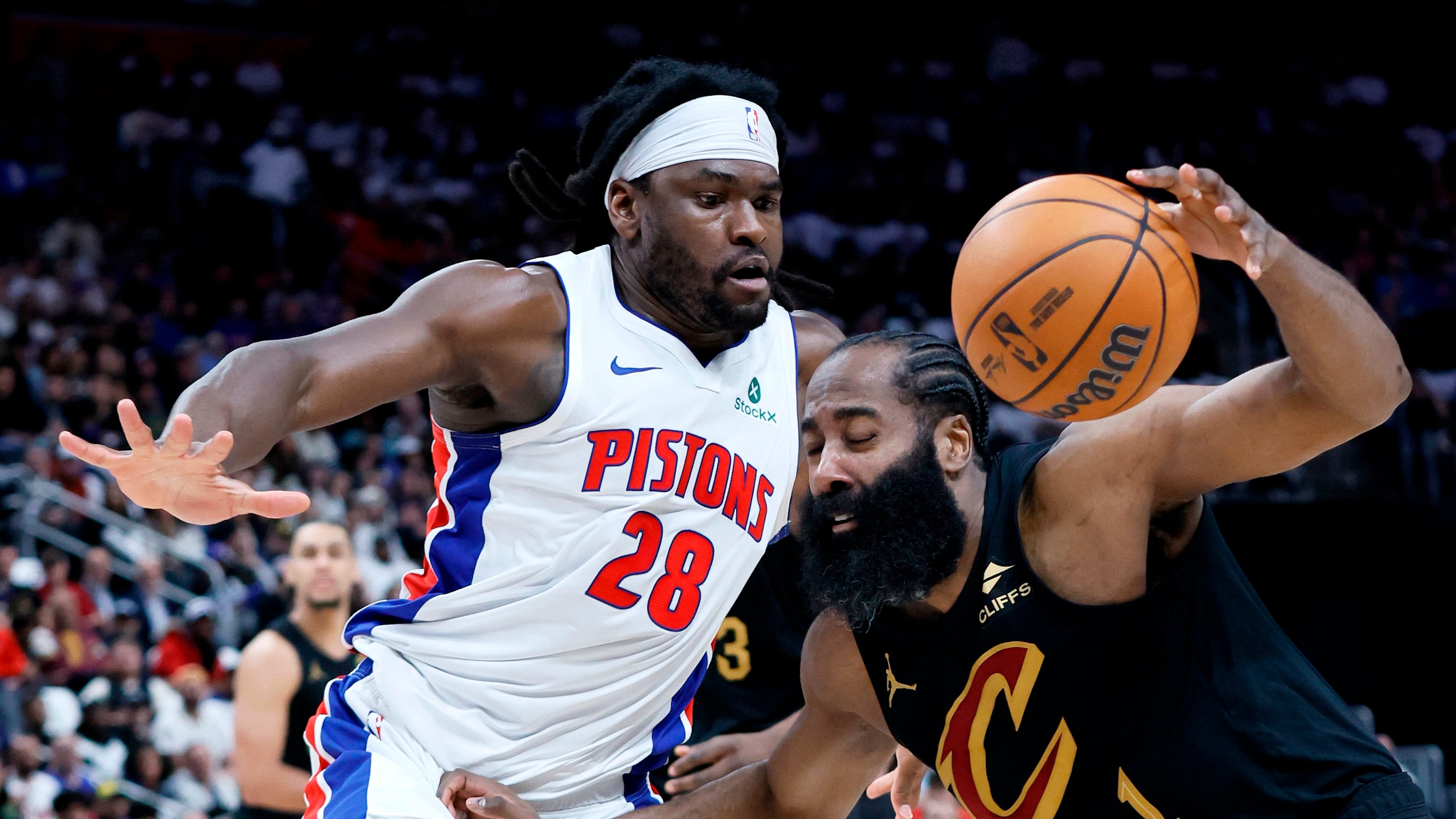 Cleveland Cavaliers guard James Harden (1) drives against Detroit Pistons forward Isaiah Stewart (28) during the first half in Game 1 of a second-round NBA playoffs basketball series Tuesday, May 5, 2026, in Detroit. (AP Photo/Duane Burleson)