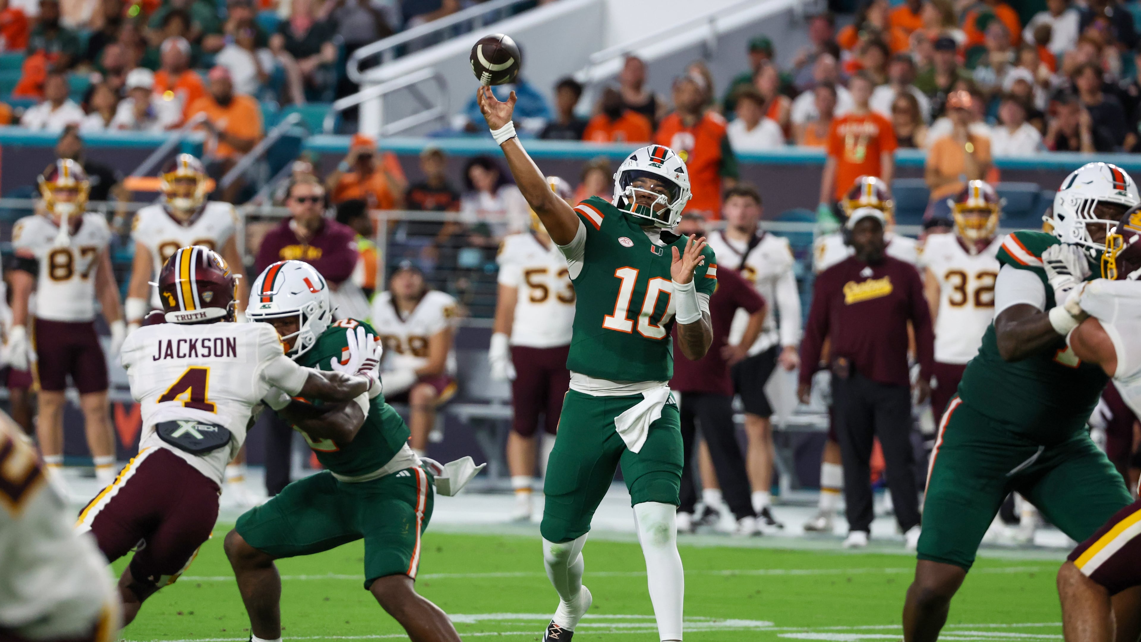 Miami quarterback Darian Mensah (10) throws a touchdown pass against Central Michigan during the first half of an NCAA college football game, Saturday, Sept. 26, 2026, in Miami Gardens, Fla. (AP Photo/David Santiago)