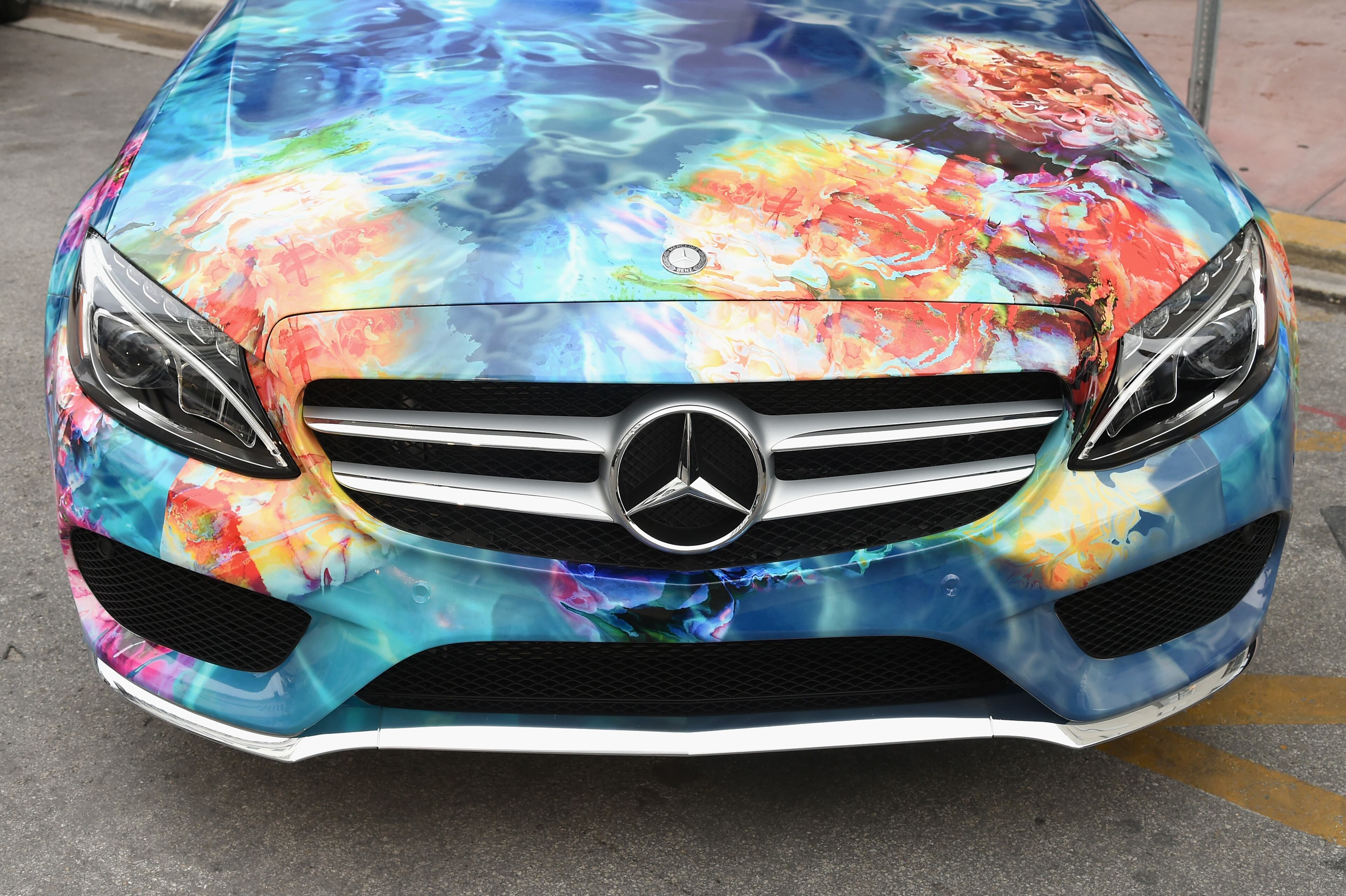 MIAMI BEACH, FL - JULY 17: A 2015 Mercedes-Benz C-Class featuring an exclusive design by Beach Bunny on display during Mercedes-Benz Fashion Week Swim 2015 at The Raleigh on July 17, 2014 in Miami Beach, Florida. (Photo by Andrew H. Walker/Getty Images for Mercedes-Benz Fashion Week )