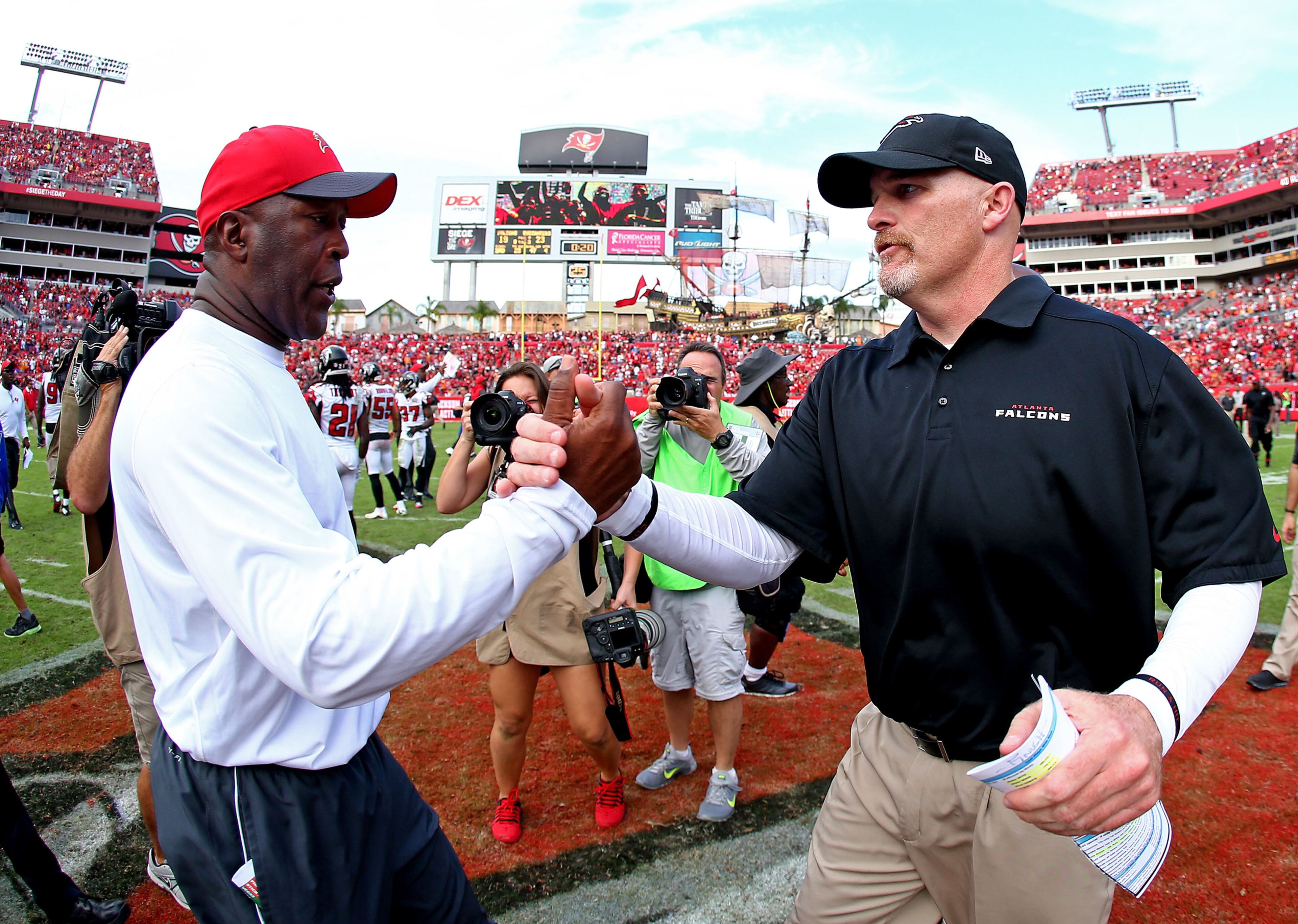 TAMPA, FL - DECEMBER 06: Head coaches Lovie Smith of the Tampa Bay Buccaneers and Dan Quinn of the Atlanta Falcons shake hands after the game at Raymond James Stadium on December 6, 2015 in Tampa, Florida. (Photo by Rob Foldy/Getty Images)