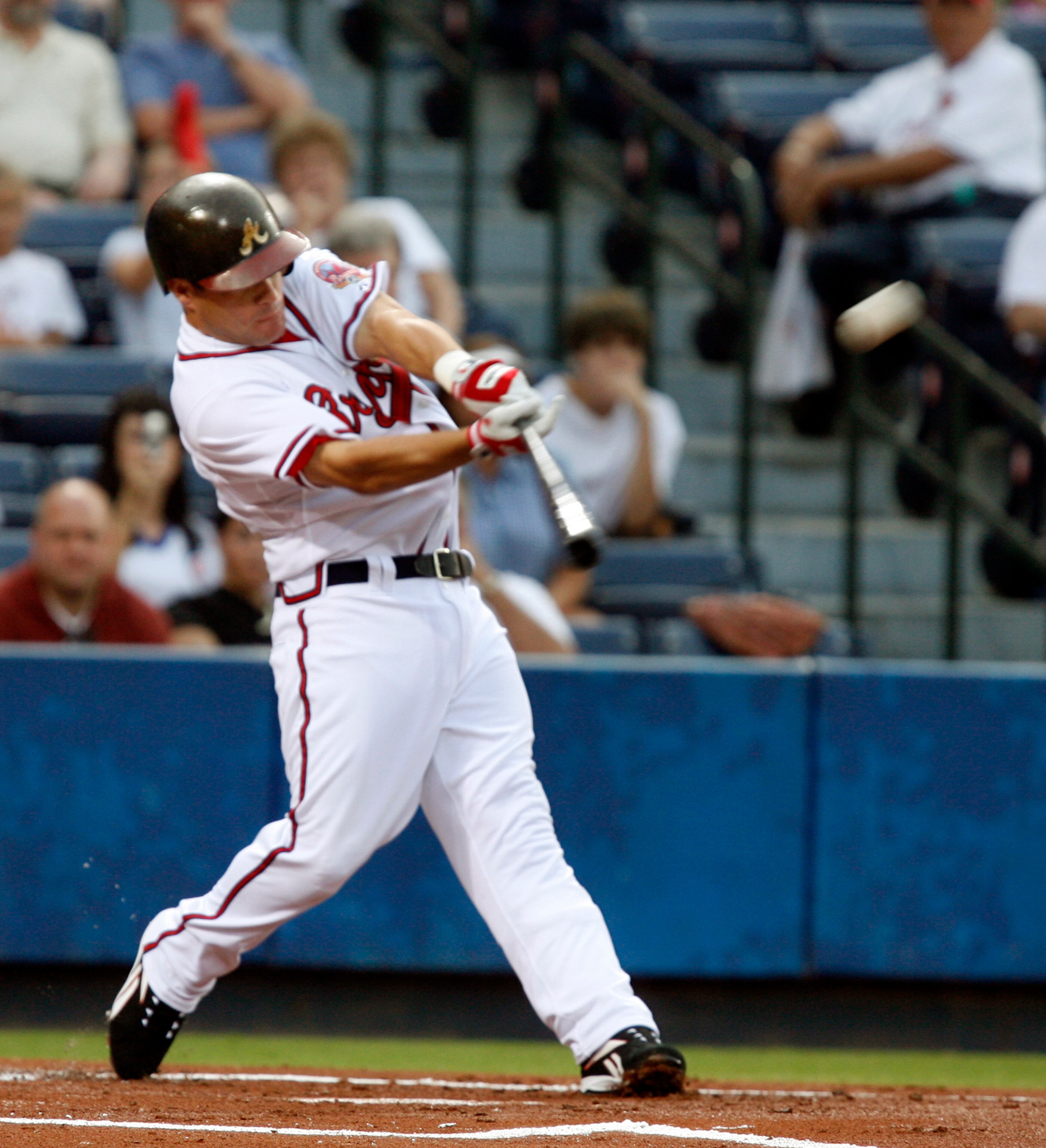 The Atlanta Braves' Marcus Giles hits this home run in the first inning. (JENNI GIRTMAN/AJC staff)