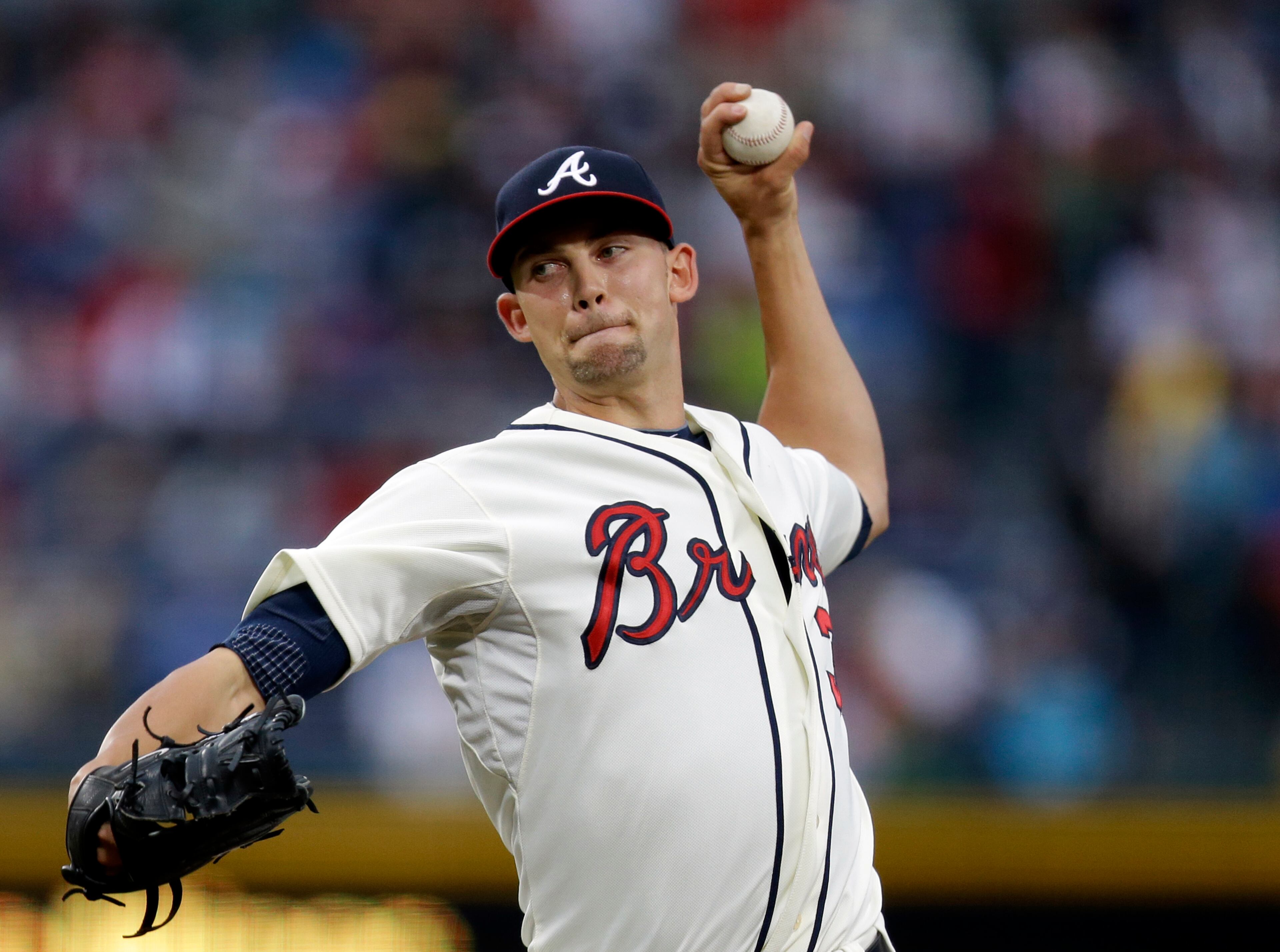 Atlanta Braves starting pitcher Mike Minor throws in the first inning of a baseball game against the Washington Nationals, Saturday, Aug. 17, 2013, in Atlanta. (AP Photo/David Goldman)