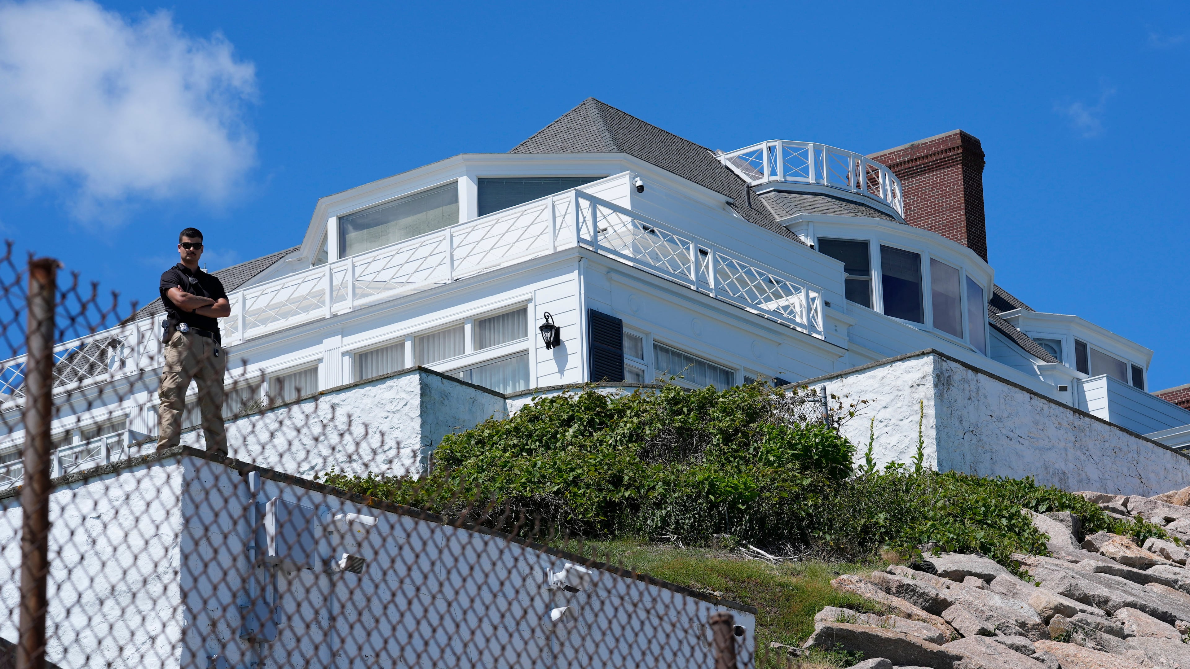 A security guard stands watch at Taylor Swift's "Holiday House," Saturday, June 20, 2026, in Westerly, R.I. (AP Photo/Robert F. Bukaty)