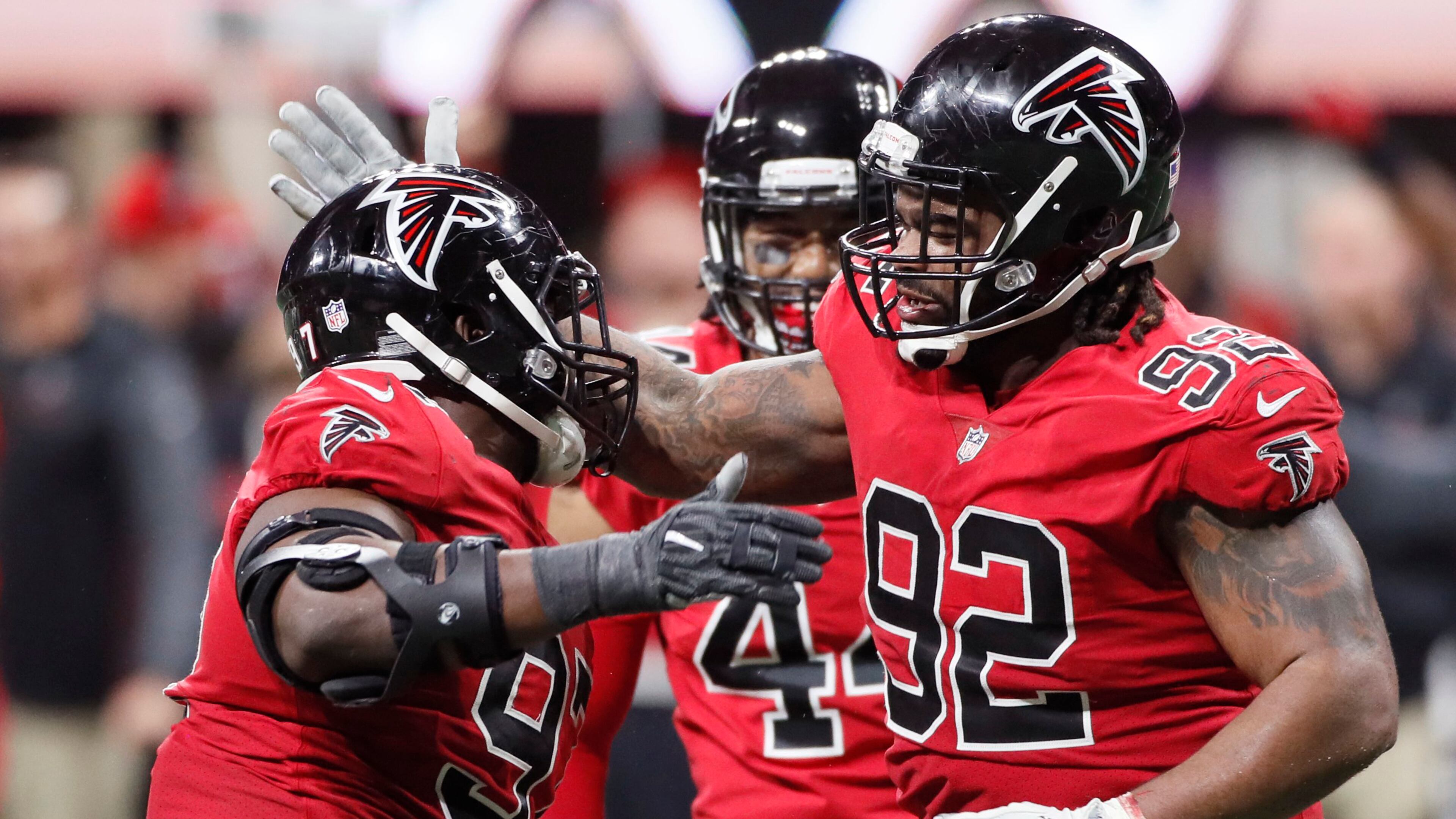 Atlanta Falcons defensive tackle Dontari Poe (92) and Grady Jarrett (97) celebrate after a sack Thursday, Dec. 7, 2017, against the Saints at Mercedes-Benz Stadium in Atlanta.