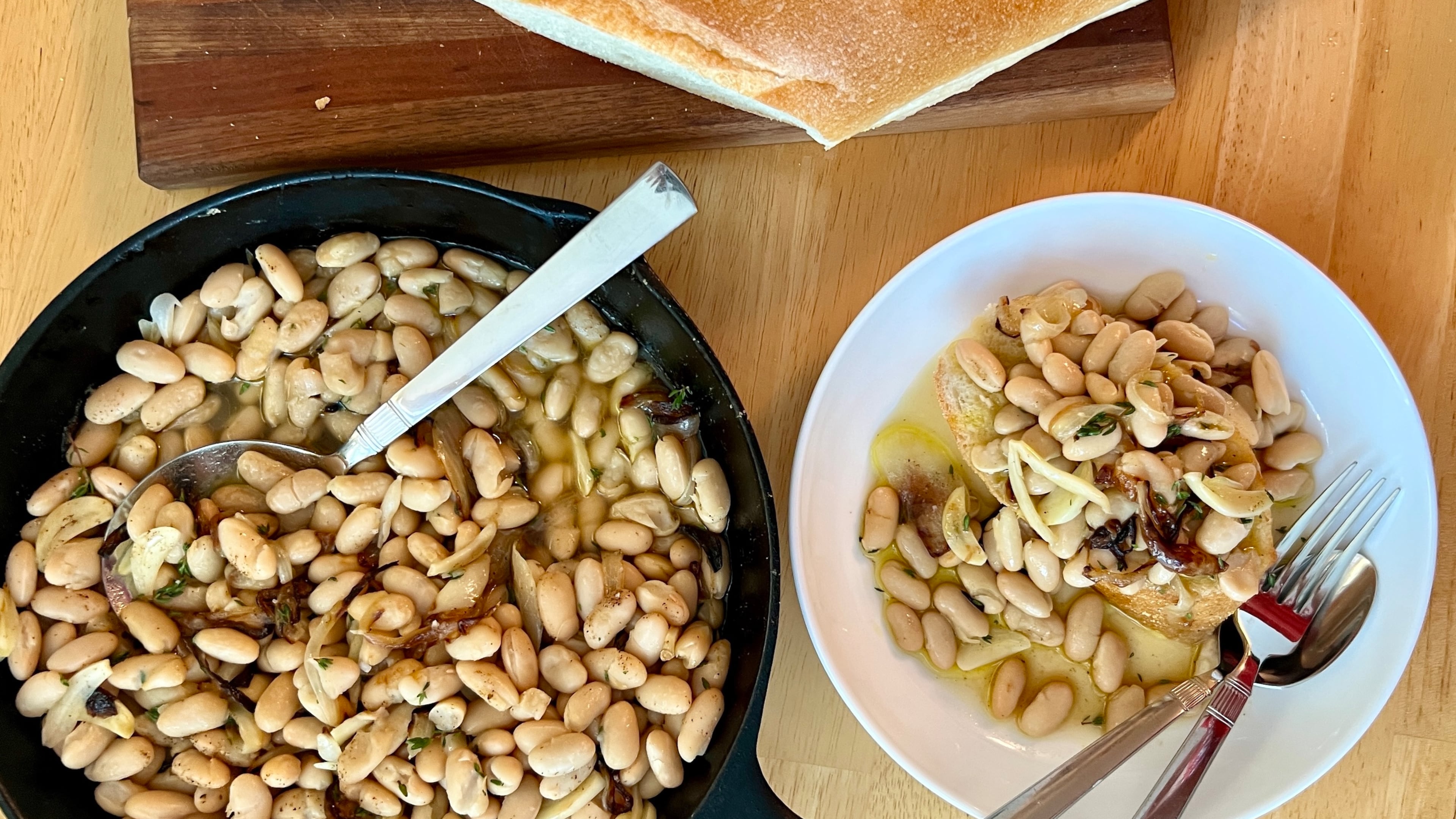 Tuscan white beans flavored with onions, garlic, thyme and broth are equally comforting and convenient. (Virginia Willis for the AJC)