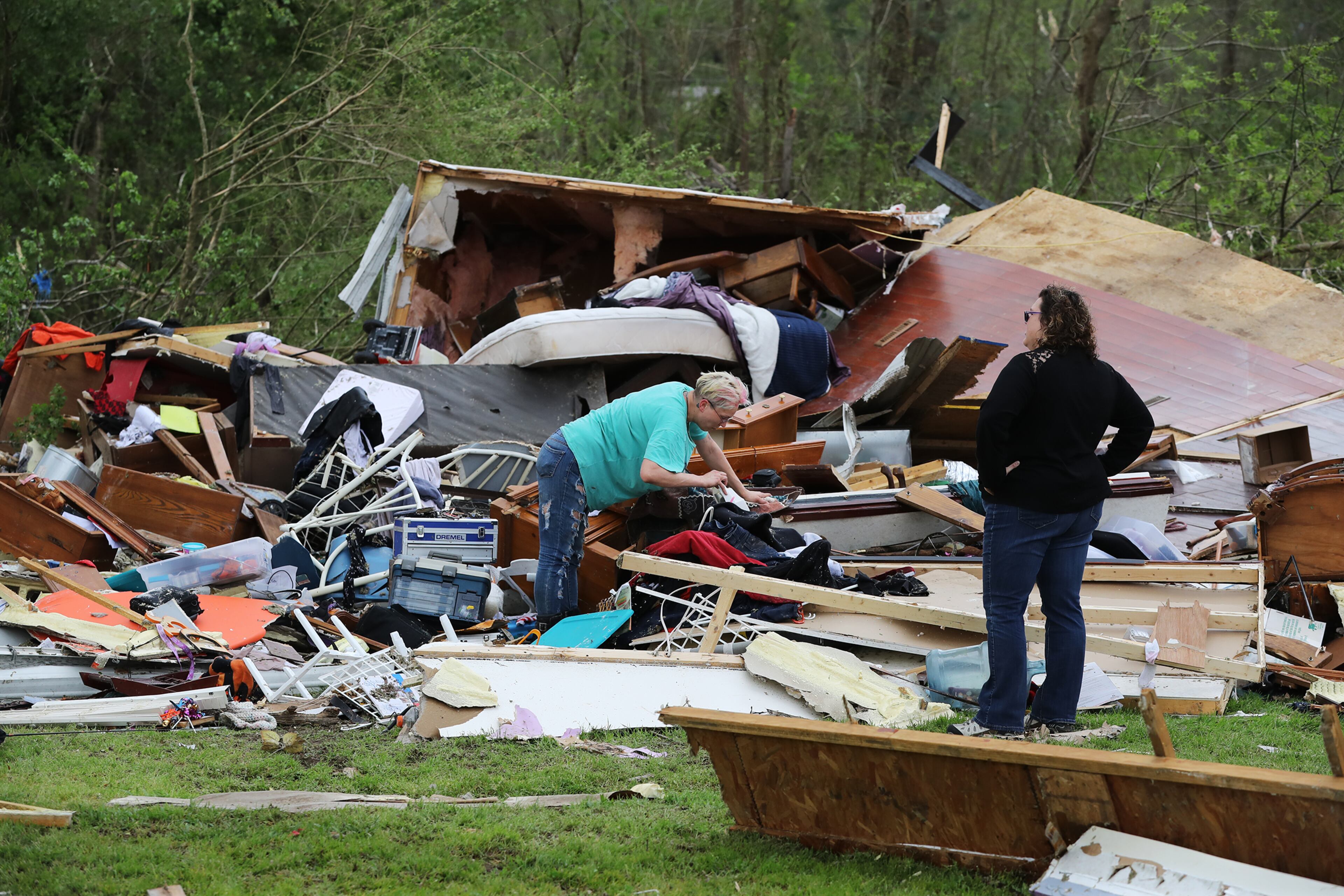 April 13, 2020 Chatsworth: Survivors dig through the remains of their home in Deer Park trailer park after a deadly tornado killed at least 7 in Murray County on Monday, April 12, 2020, in Chatsworth. Curtis Compton ccompton@ajc.com