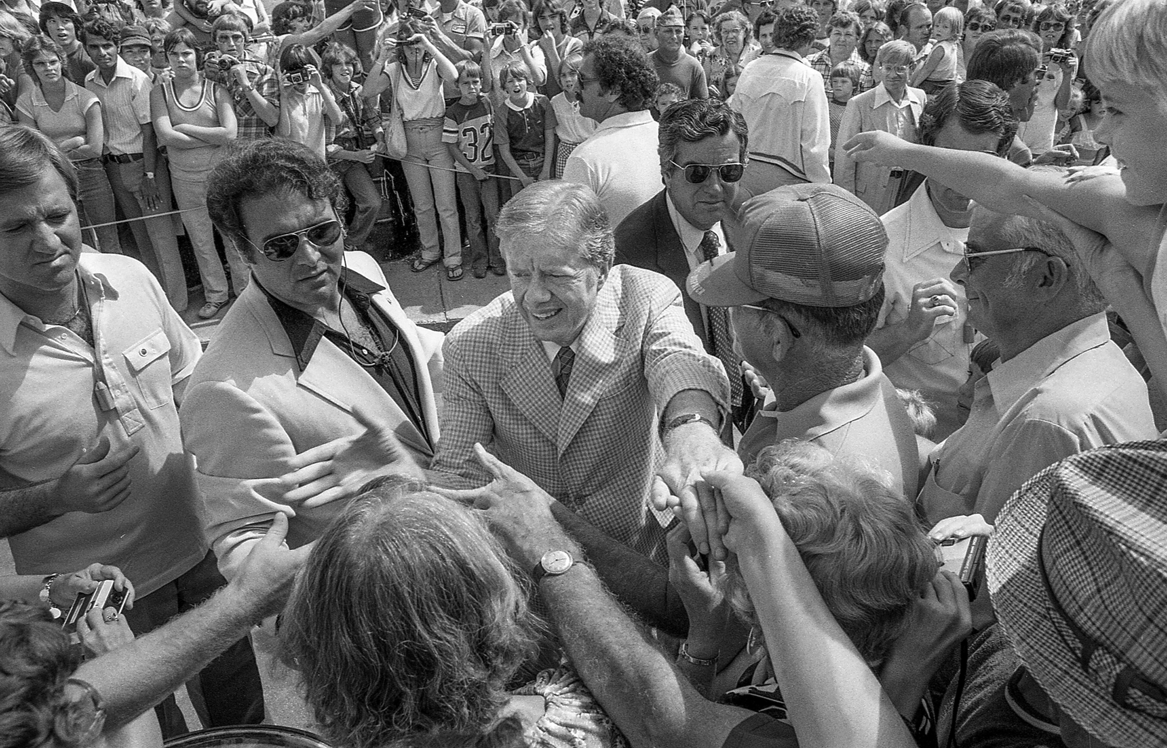 President Jimmy Carter, traveling with First Lady Rosalynn and daughter Amy, arrived in Hannibal, Missouri by river boat on Aug. 23, 1979 and toured the Mark Twain Museum and Boyhood Home. He moved through large crowds, shaking hands and picking up babies. (John Spink / Shot for the Kansas City Times)