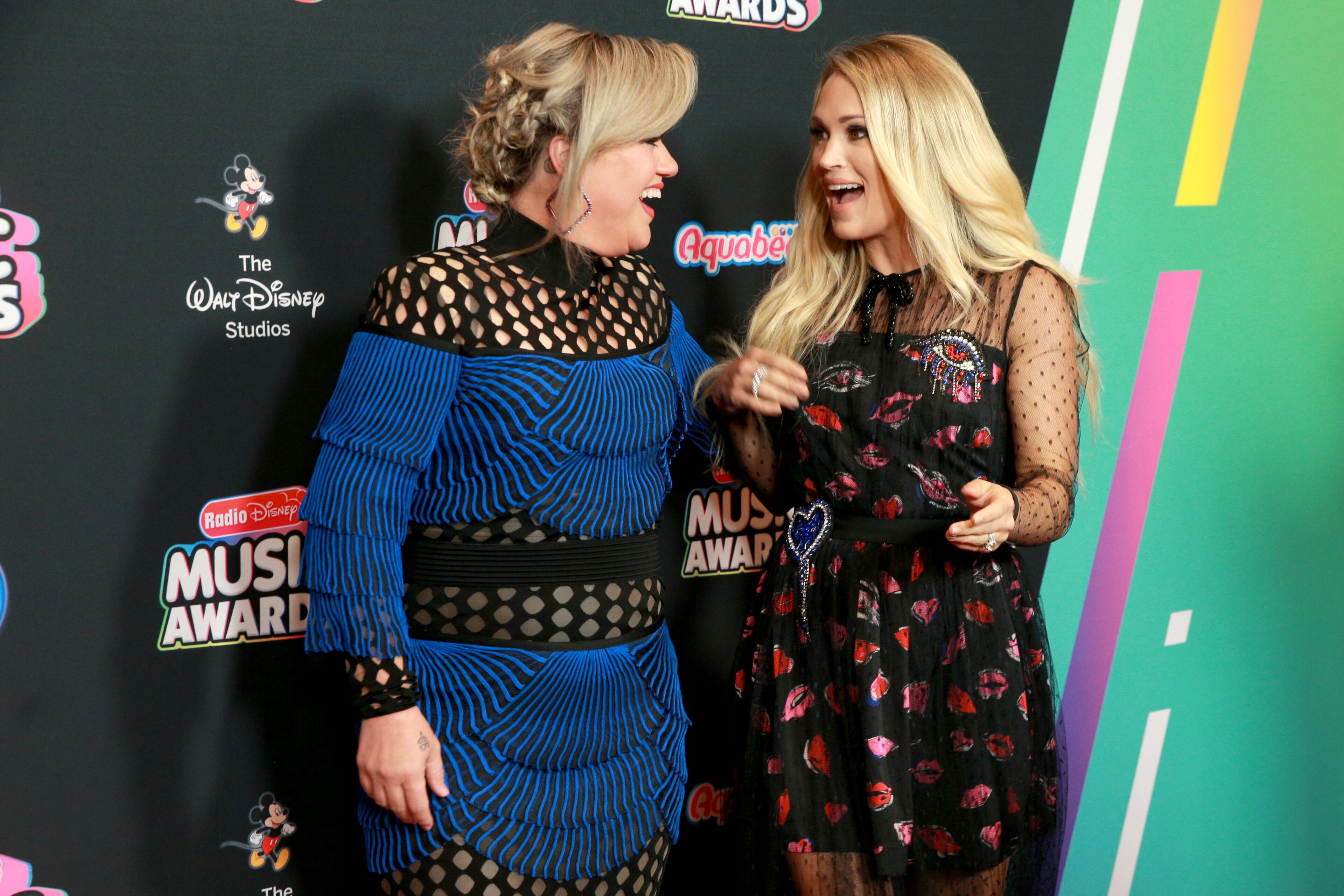 HOLLYWOOD, CA - JUNE 22: Kelly Clarkson and Carrie Undewood attend the 2018 Radio Disney Music Awards at Loews Hollywood Hotel on June 22, 2018 in Hollywood, California. (Photo by Rich Fury/Getty Images)