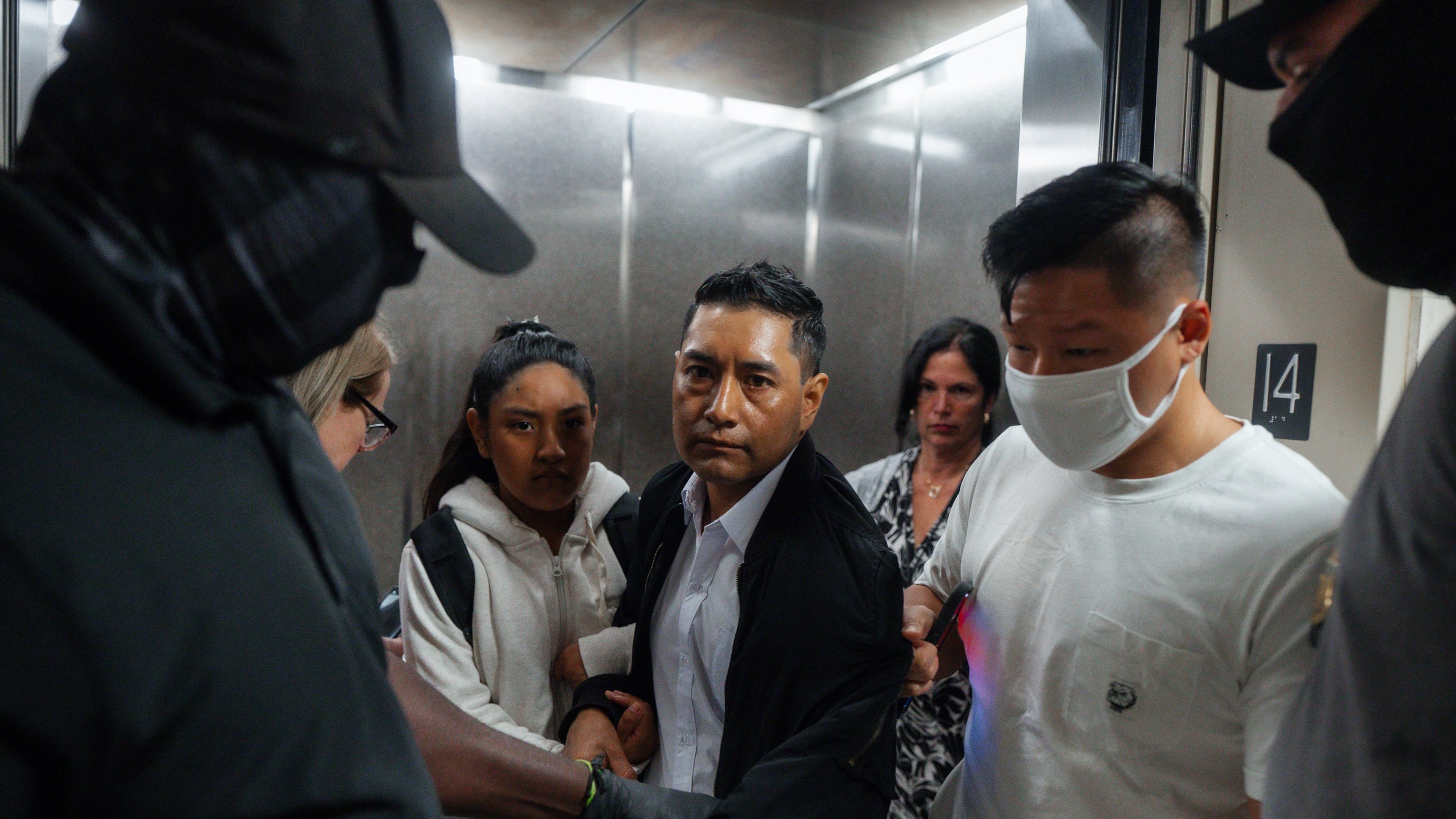 FILE - Immigration and Customs Enforcement agents pull a man out of an elevator as he and his daughter attempt to leave following a hearing in immigration court, Friday, Sept. 5, 2025, in New York. (AP Photo/Olga Fedorova,File)