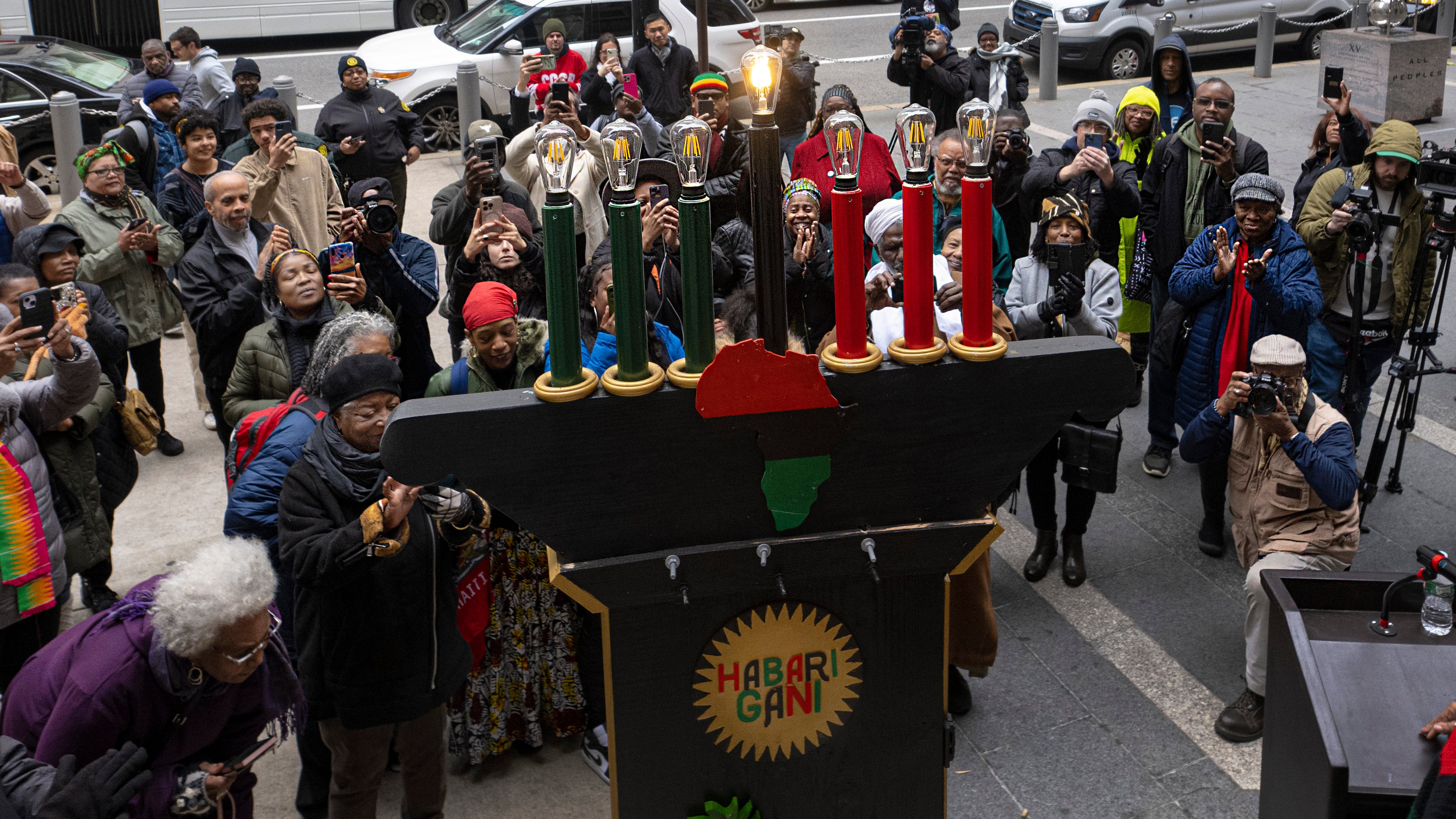 FILE - Philadelphians and visitors gather during the the lighting of the city's first kinara on the first day of Kwanzaa celebrations at the Philadelphia City Hall grounds, Dec. 26, 2023. (Jose F. Moreno/The Philadelphia Inquirer via AP, File)