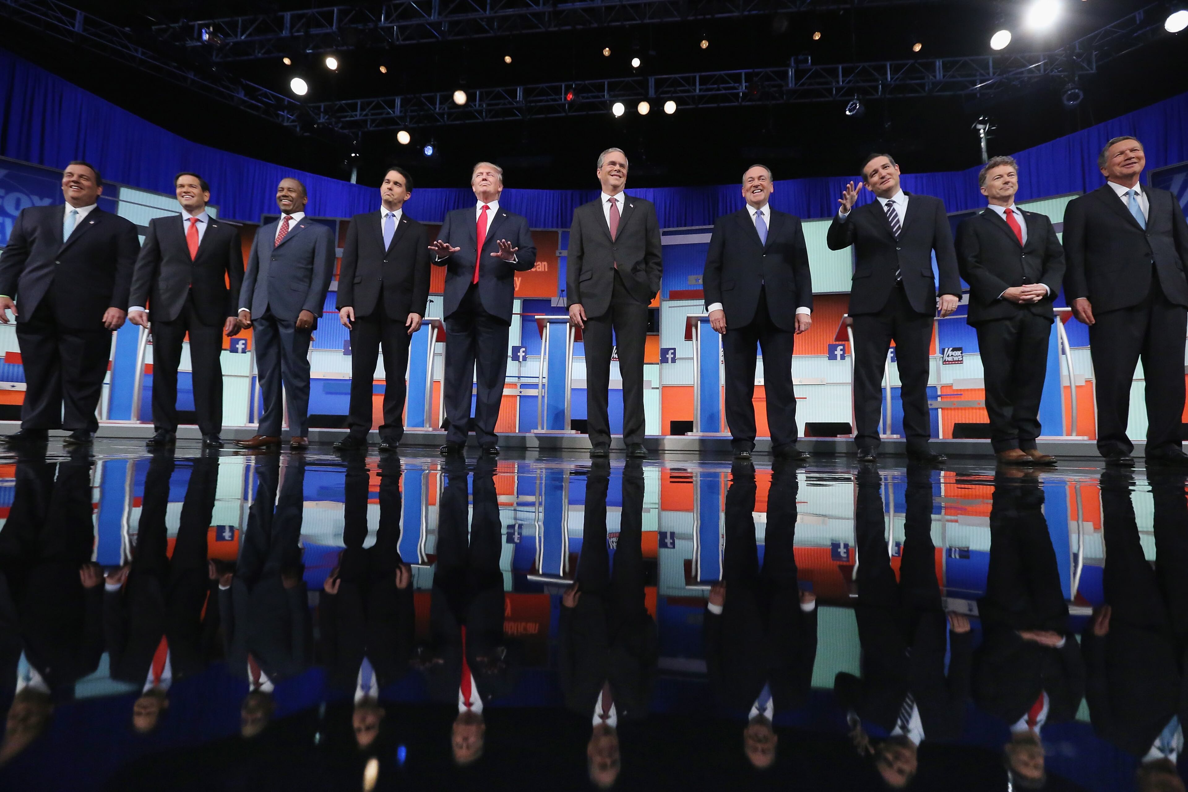 CLEVELAND, OH - AUGUST 06: Republican presidential candidates (L-R) New Jersey Gov. Chris Christie, Sen. Marco Rubio (R-FL), Ben Carson, Wisconsin Gov. Scott Walker, Donald Trump, Jeb Bush, Mike Huckabee, Sen. Ted Cruz (R-TX), Sen. Rand Paul (R-KY) and John Kasich take the stage for the first prime-time presidential debate hosted by FOX News and Facebook at the Quicken Loans Arena August 6, 2015 in Cleveland, Ohio. The top-ten GOP candidates were selected to participate in the debate based on their rank in an average of the five most recent national political polls. (Photo by Chip Somodevilla/Getty Images)