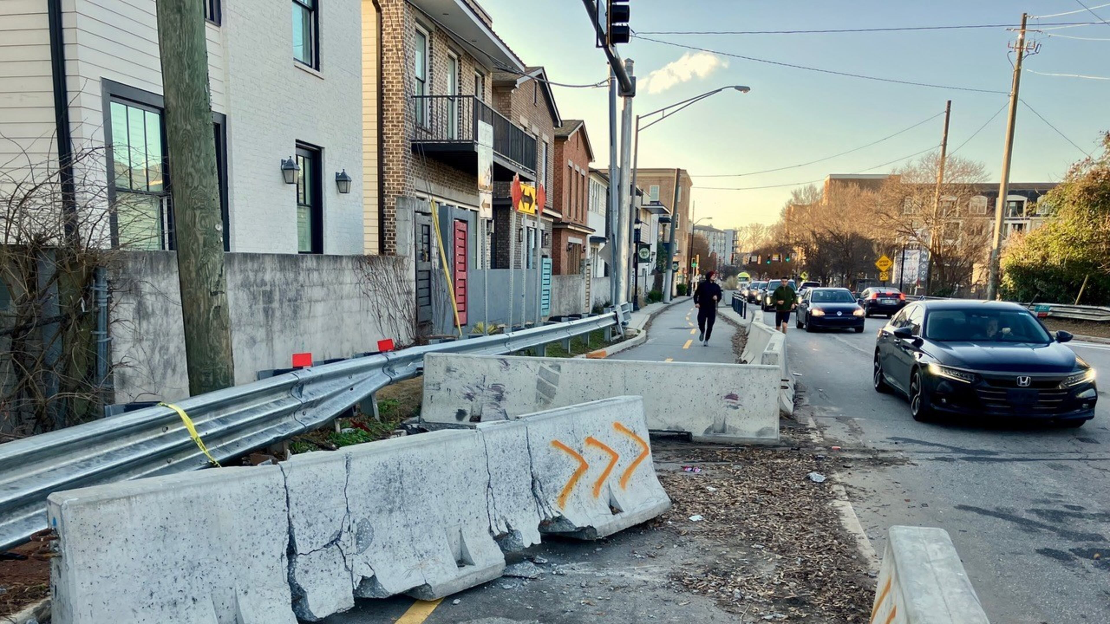 The highway exit from I-20 onto Bill Kennedy Way near Glenwood Park has been the site of multiple accidents. Some cars exiting the ramp plow through concrete barricades and onto the Atlanta Beltline, putting cyclists and pedestrians at risk. Image credit: Ken Boff.