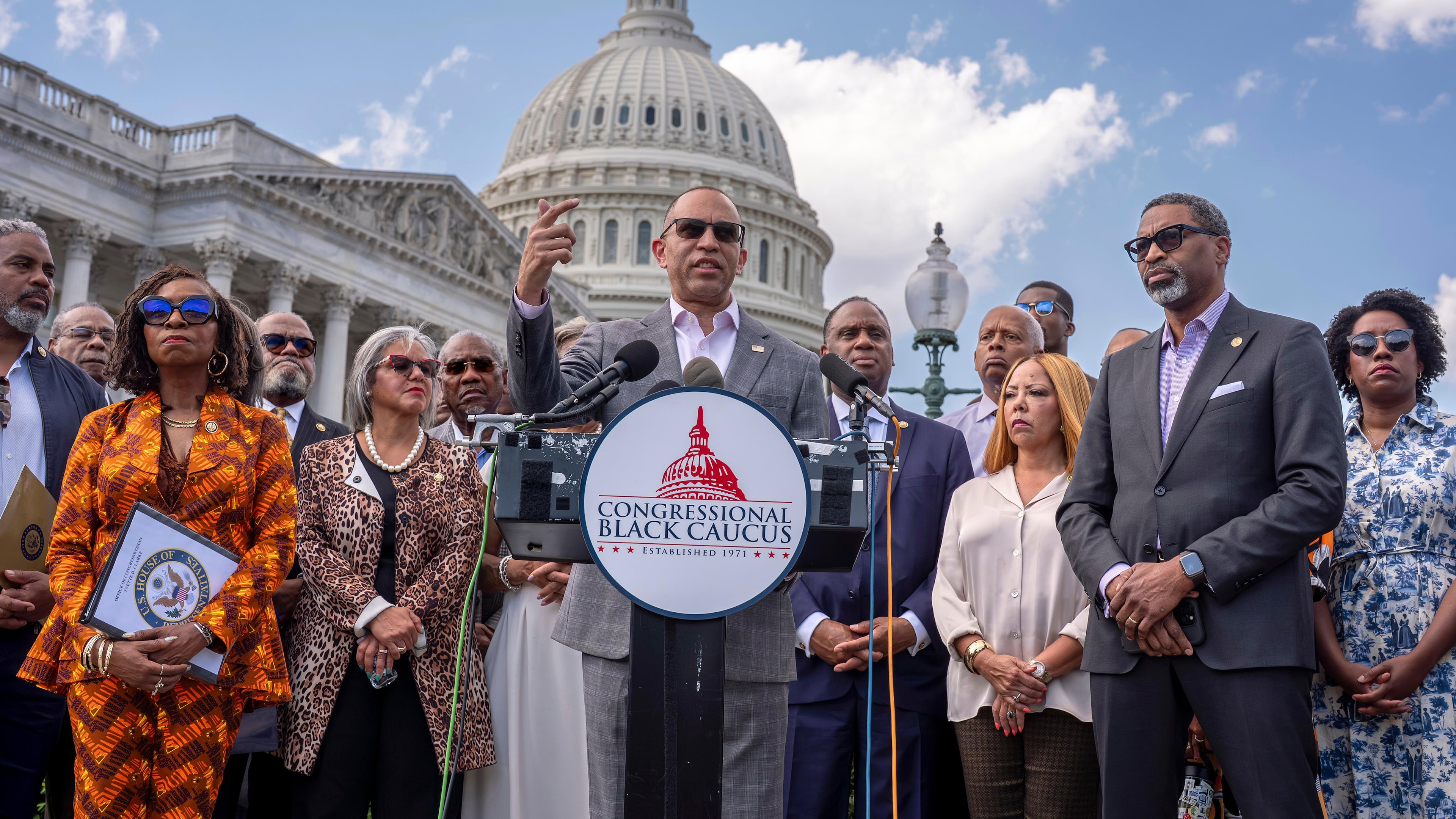 FILE - House Minority Leader Hakeem Jeffries, D-N.Y., center, and members of the Congressional Black Caucus speak outside the Capitol in Washington, May 19, 2026. (AP Photo/J. Scott Applewhite, File)