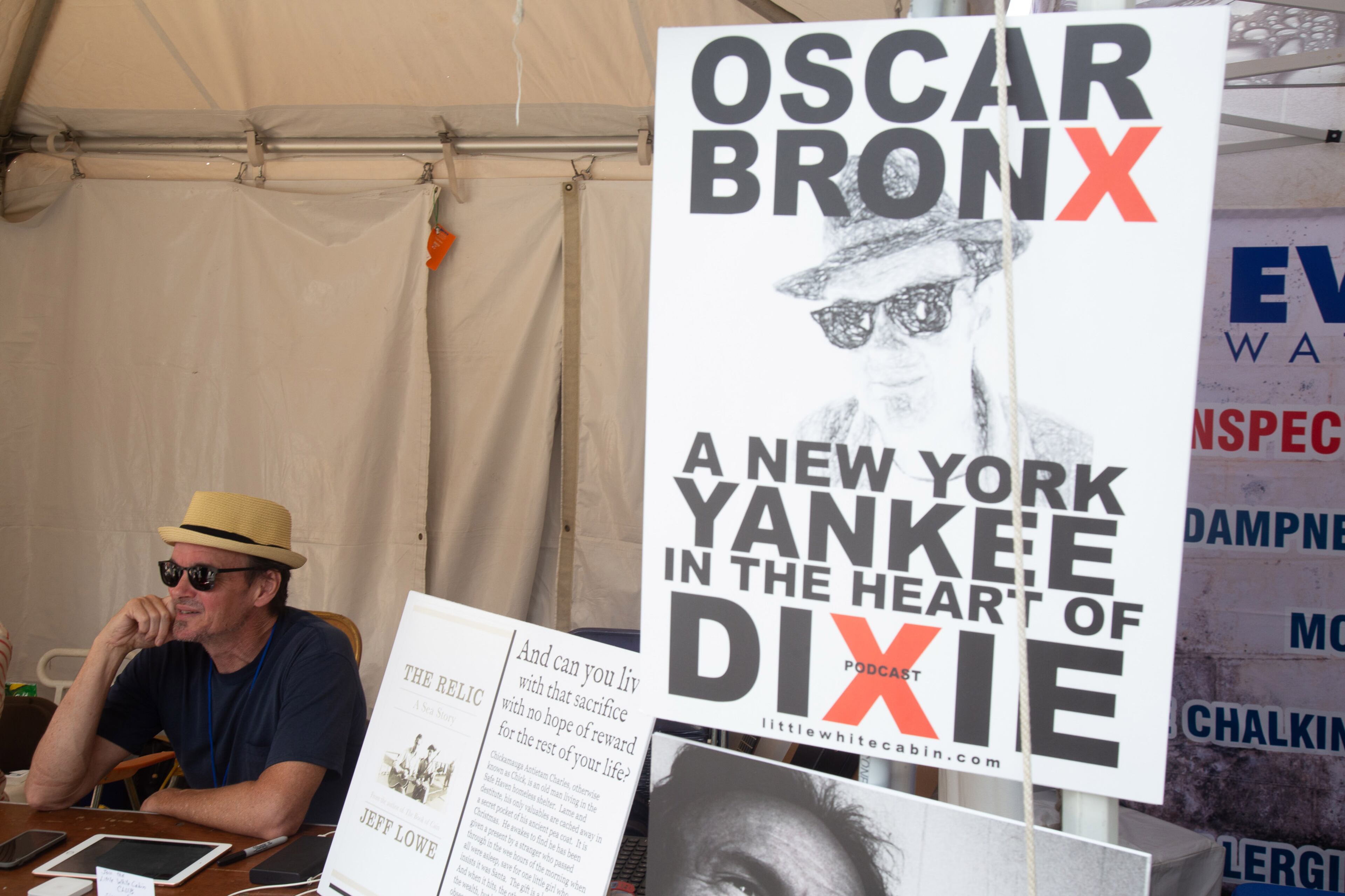 Author Oscar Bronx talks with people as they walk by his booth during the AJC Decatur Book Festival on Sunday, September 1, 2019. STEVE SCHAEFER / SPECIAL TO THE AJC