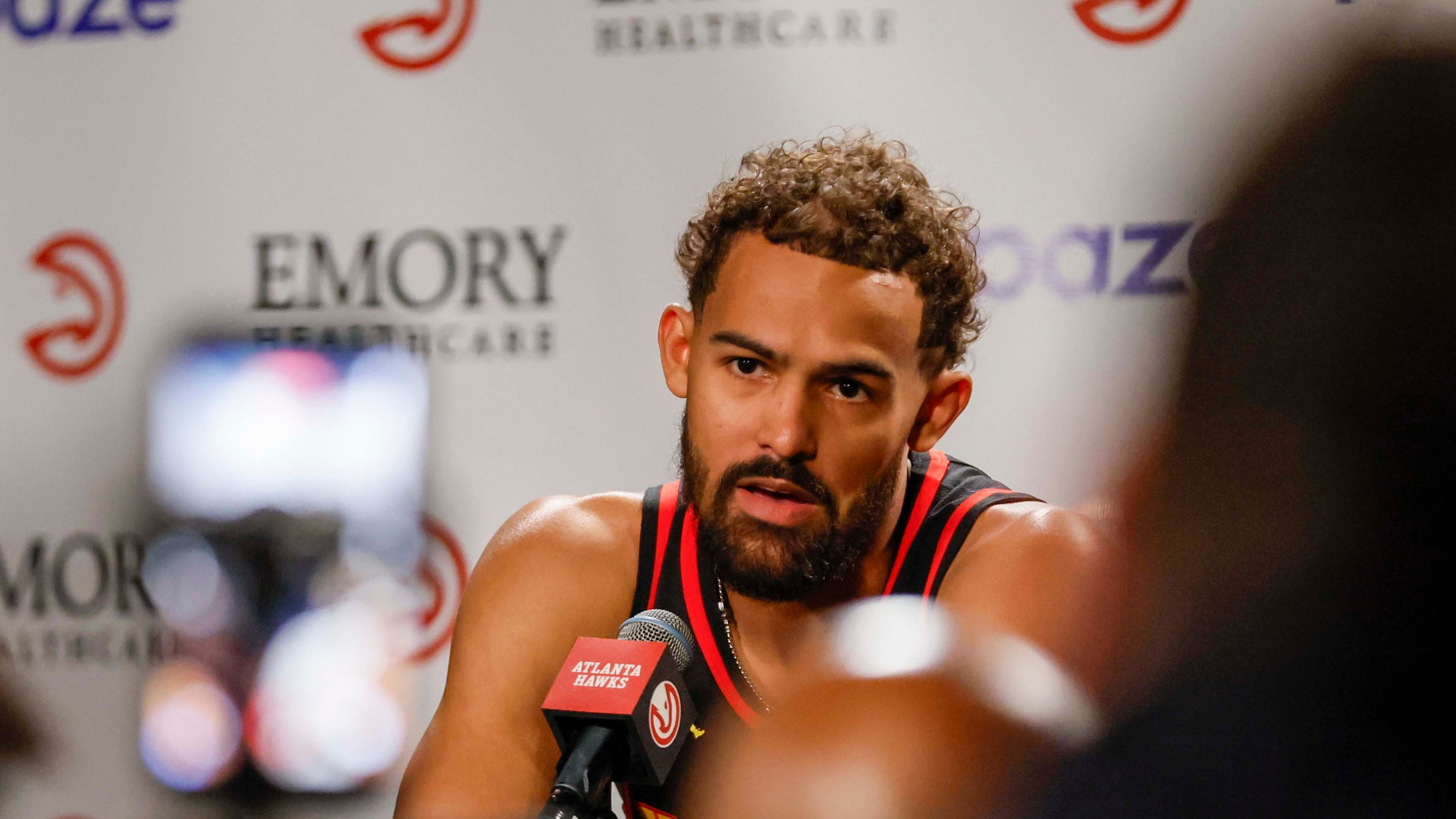 Atlanta Hawks guard Trae Young answers questions from the press during media day at PC&E Atlanta on Sept. 29, 2025, in Atlanta. The Hawks appear to be looking to trade the four-time All-Star. (Miguel Martinez/ AJC)