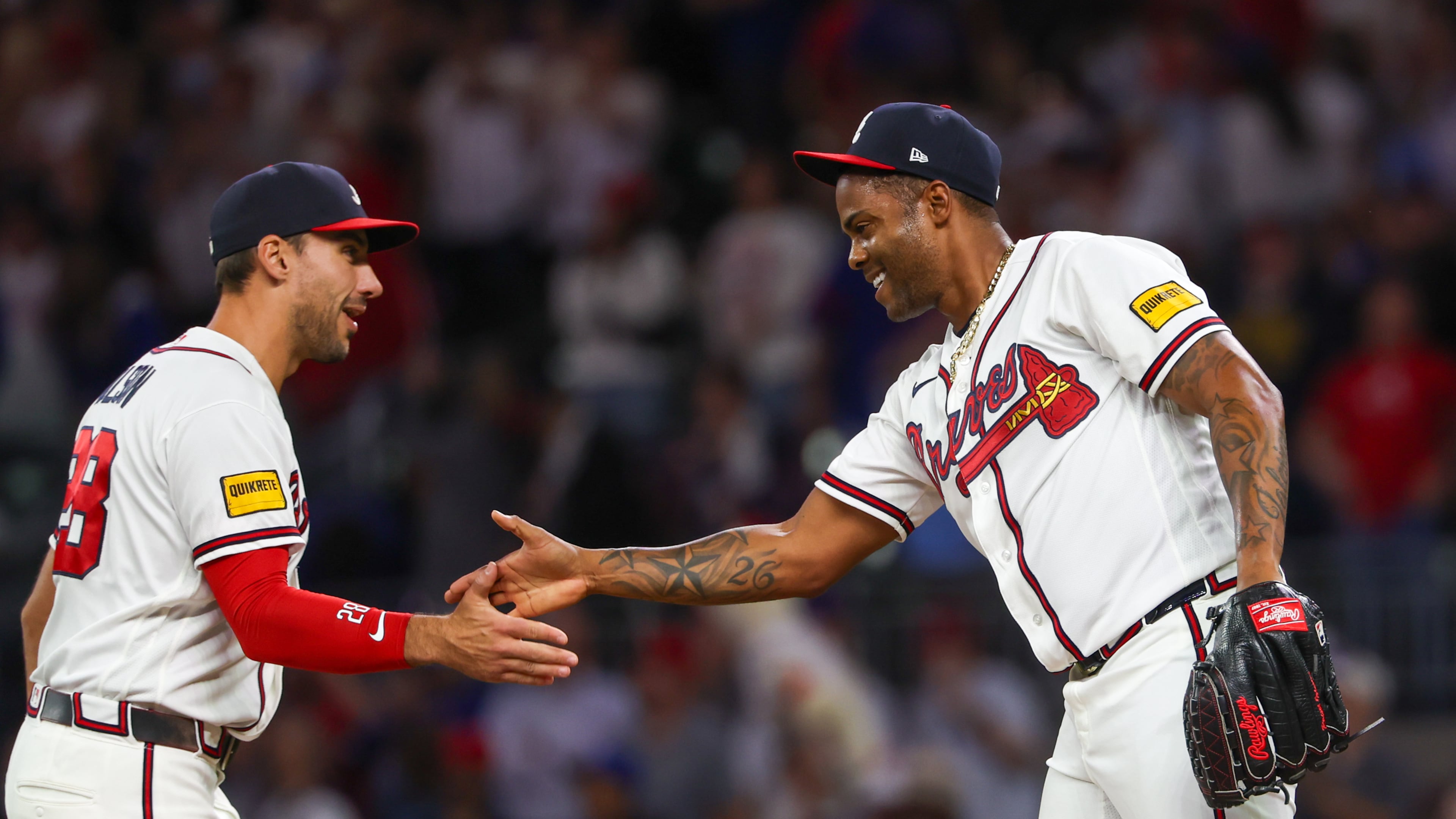 Braves first baseman Matt Olson (left) celebrates a 5-2 win against the Cubs with pitcher Raisel Iglesias on Tuesday, May 12, 2026, at Truist Park in Atlanta. The 2026 Braves are dominating the NL East like no other team ever has at this point of the year. (Arvin Temkar/AJC)